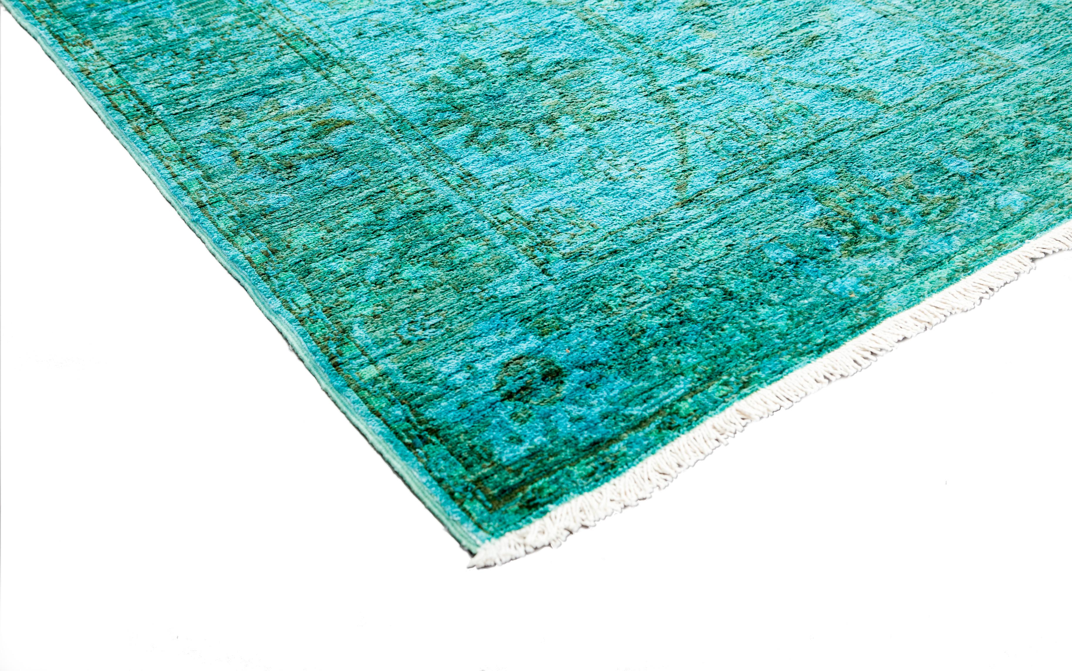Color: Green - Made in: Pakistan. 100% wool. Bridging the gap between traditional and modern, the Transitional collection features rugs that exemplify versatility. They incorporate both time-honored motifs and, courtesy of 100%-natural botanical