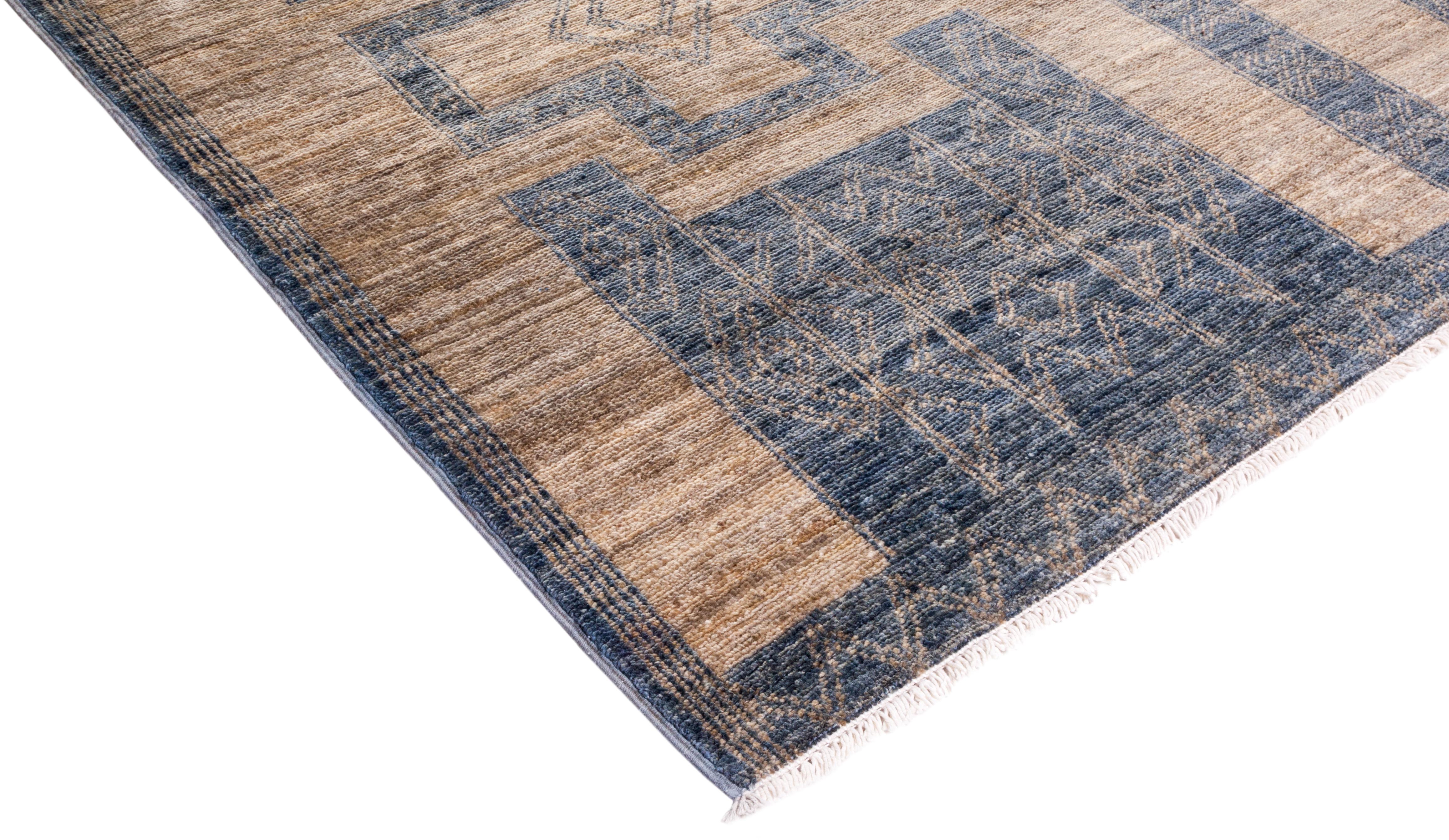 Color: Ivory, made in Pakistan. 100% wool. The rich textile tradition of western Africa inspired the Tribal collection of hand knotted rugs. Incorporating a medley of geometric motifs, in palettes ranging from earthy to vivacious, these rugs bring a