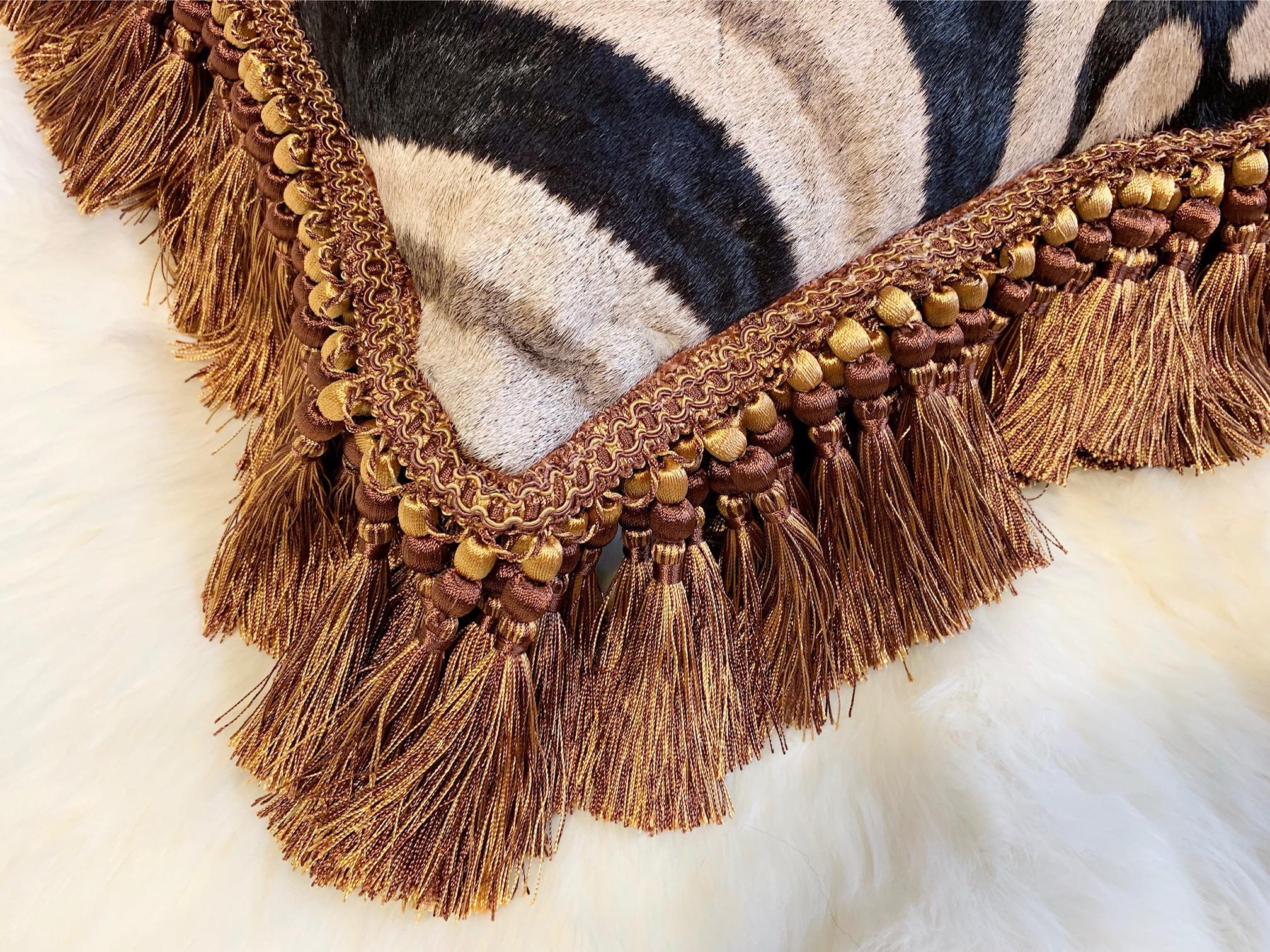 Forsyth zebra hide pillows are simply the best. The most beautiful hides are selected, handcut, handstitched, and hand stuffed with the finest goose down. Each step is meticulously curated by Saint Louis based Forsyth artisans. This copper fringe