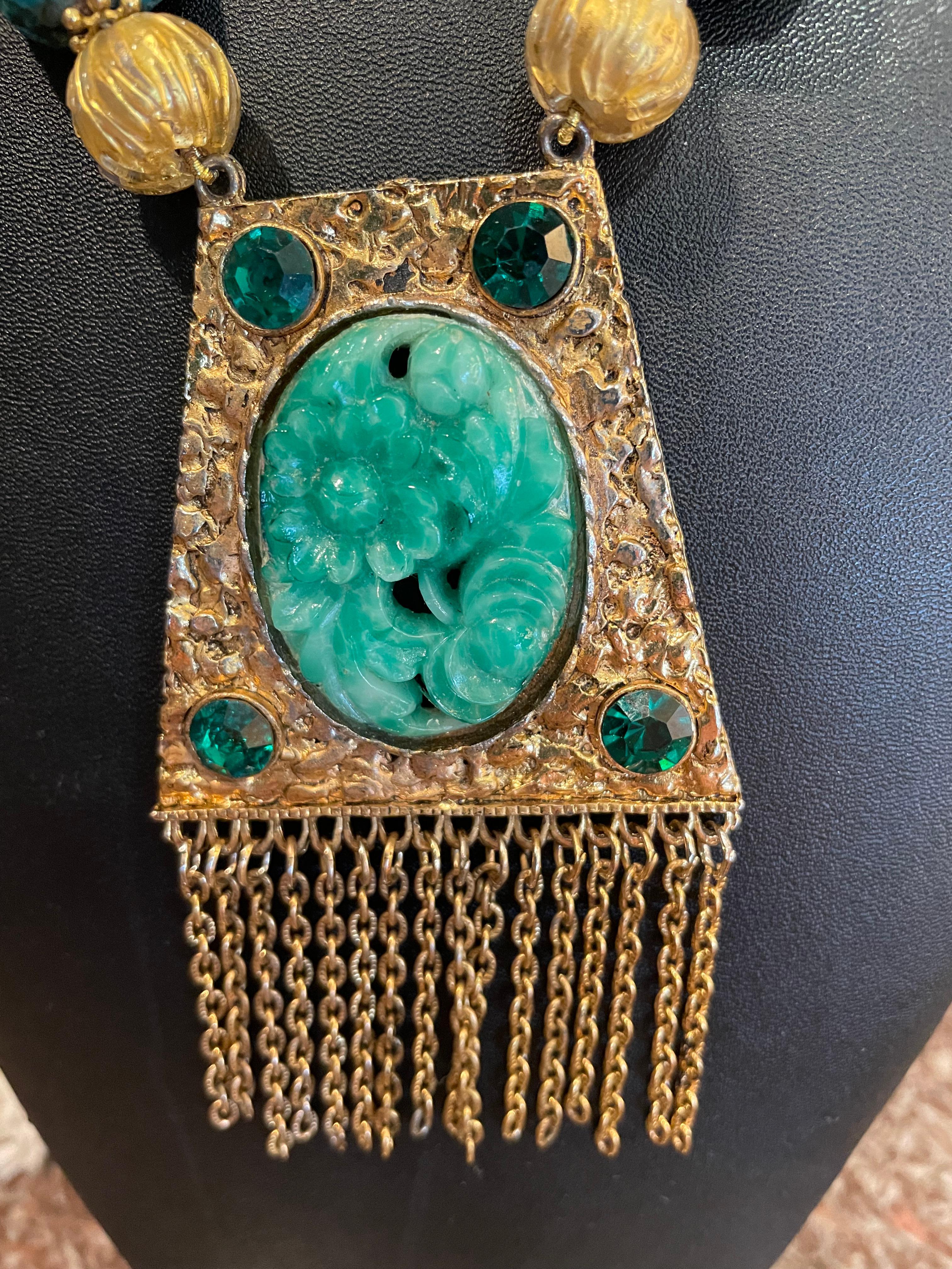 One of a kind,handmade,vintage faux ‘jade’ pendant from the 60’s on a strand of Venetian glass,vermeil, turquoise,and vintage faceted glass is on offer from Lorraine’s Bijoux.This modernized Renaissance style is smashing !