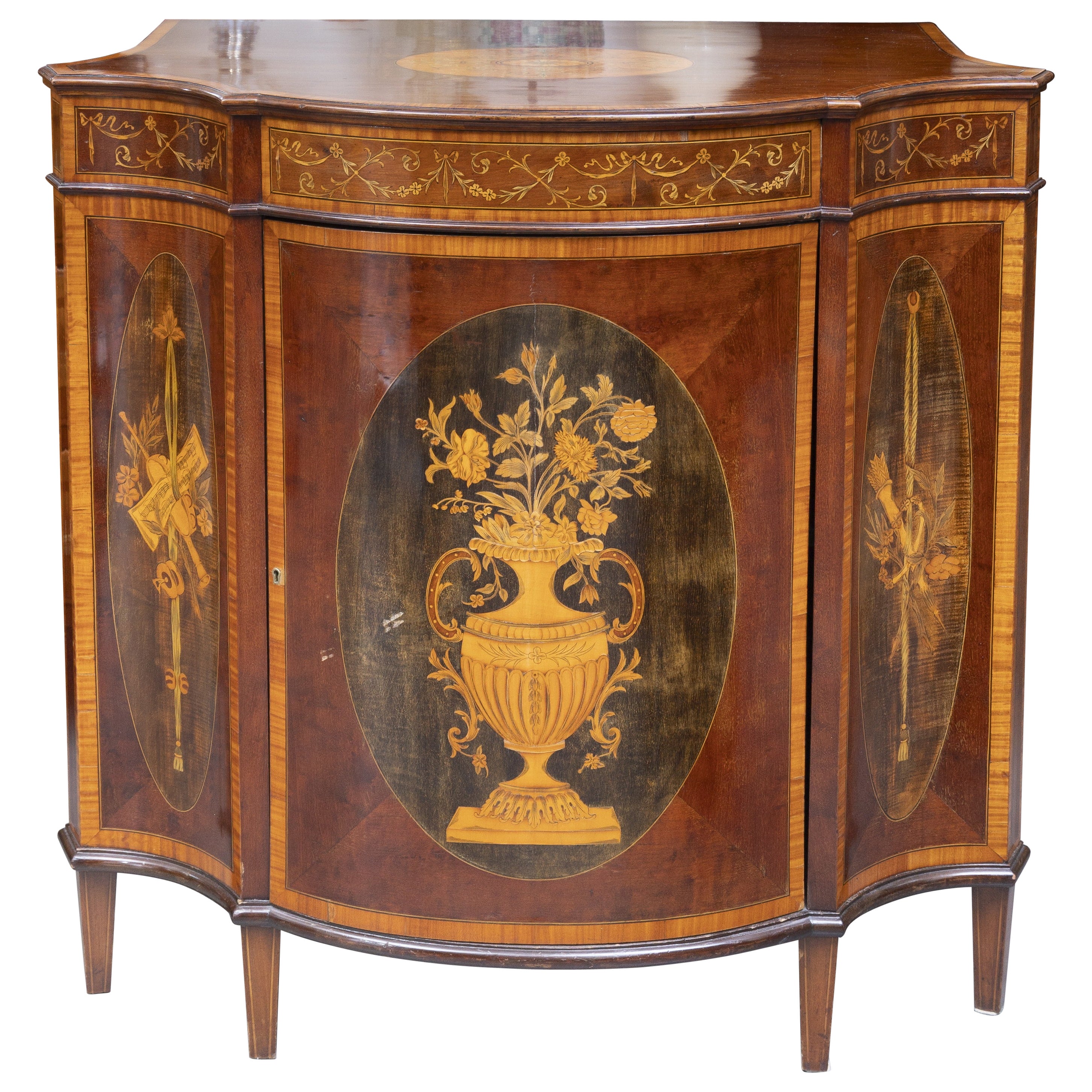 One of a Pair of English Satinwood, Mahogany and Painted Serpentine Cabinets