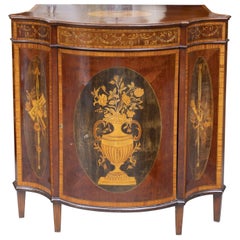 One of a Pair of English Satinwood, Mahogany and Painted Serpentine Cabinets