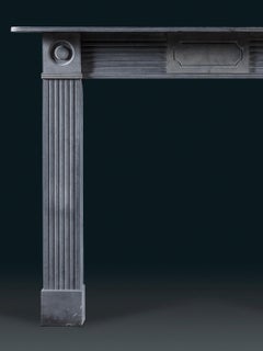 One of a pair of identical Regency Blue Limestone Bullseye Chimneypieces