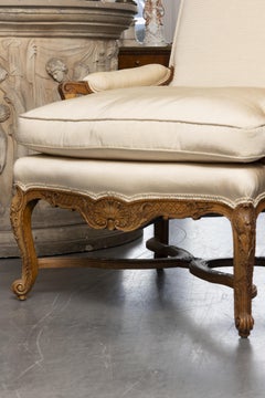 One of an Identical Pair of French Louis XV Style Walnut Armchairs