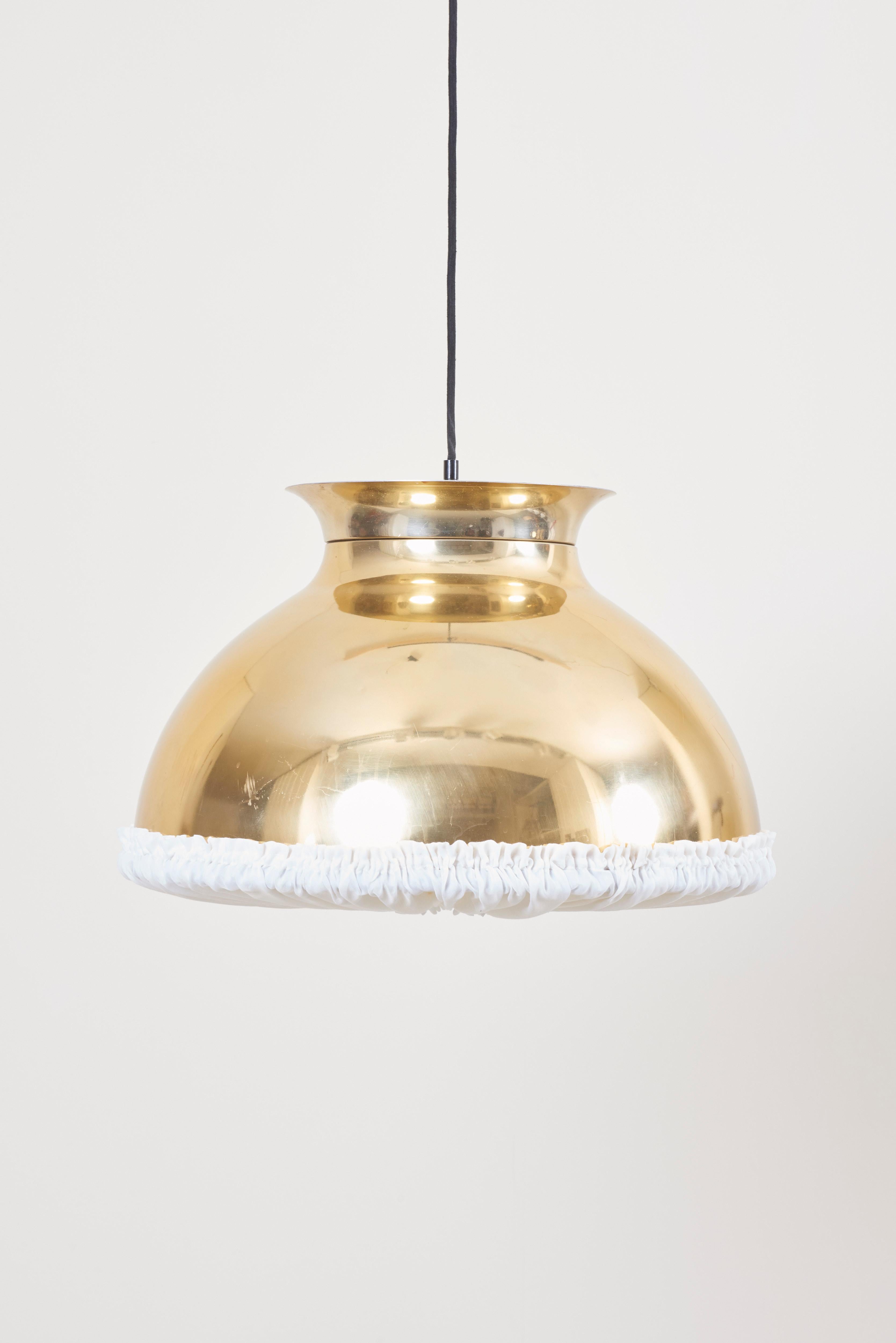 One of eight huge gold-colored pendant lamps with fabric.

The lamps should be checked locally by a specialist concerning local requirements.