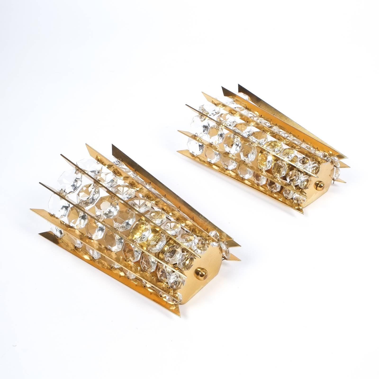 Rare set of 5 identical wall lights by Bakalowits & Sohne, Austria, circa 1955 - Priced individually

Radial array of expressively shaped brass-ware with rows of diamond cut crystals increasing/decreasing in size, These lights are handmade and are