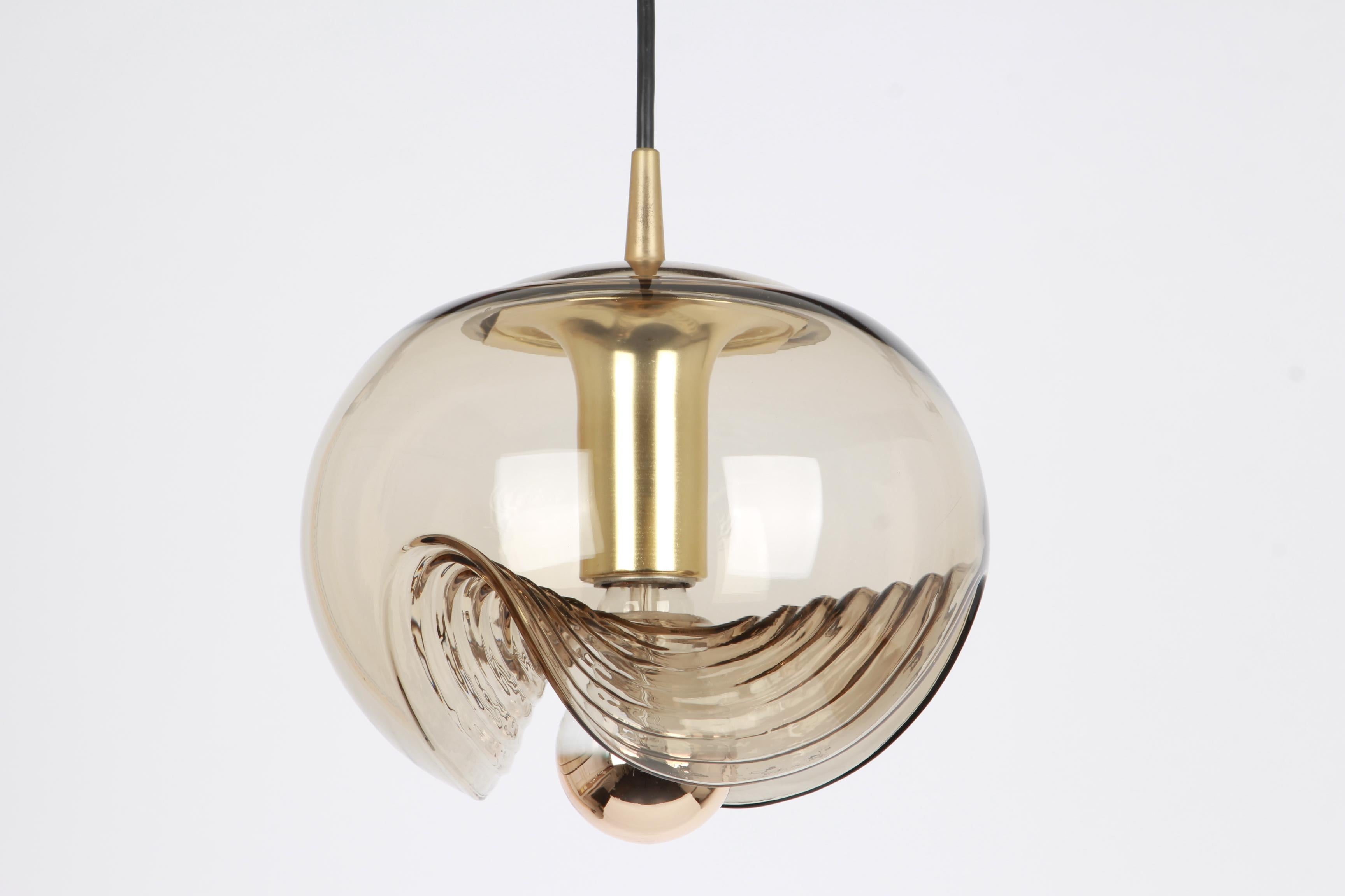 A special round biomorphic smoked glass pendant designed by Koch & Lowy for Peill & Putzler, manufactured in Germany, circa 1970s.

High quality and in very good condition. Cleaned, well-wired and ready to use. 

Each fixture requires 1 x E27
