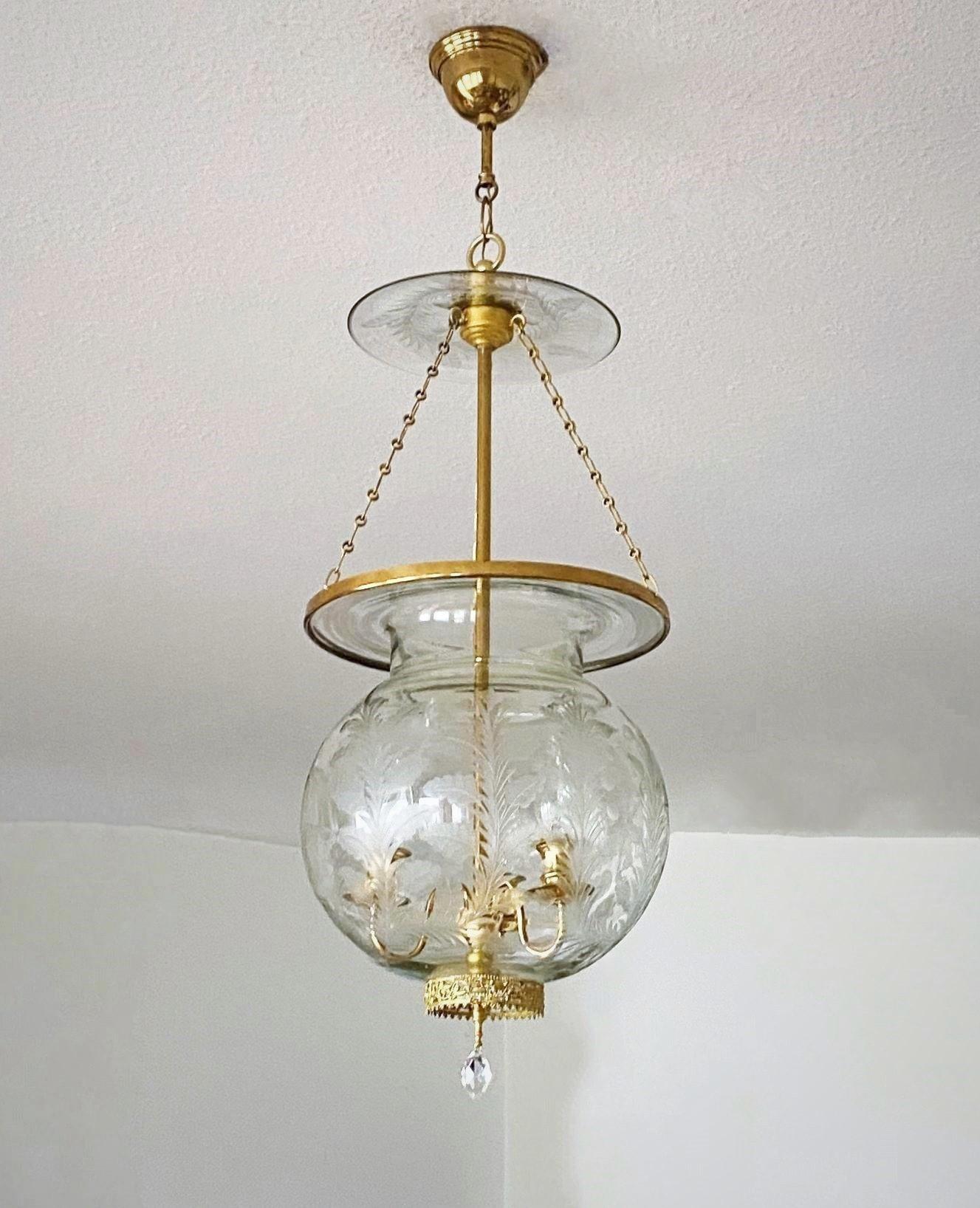One of kind hand blown clear cut glass chapel lantern with a central three-bulb candelabra cluster and elegant brass mounts, France, 1910-1920. The glass bowl and upper glass plate complete with hand-cut palm, other vegetal and geometric motifs