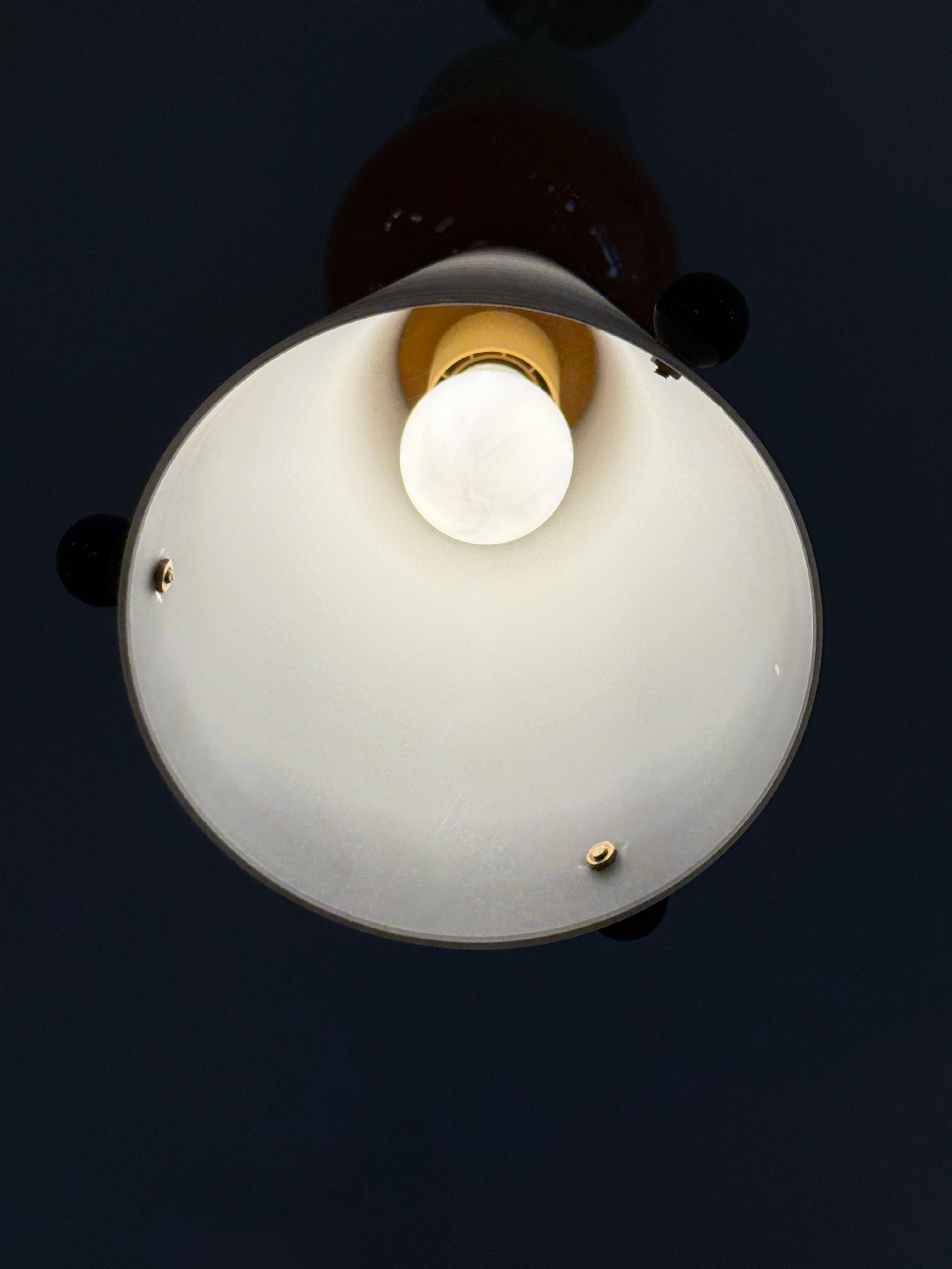 This is a RARE creation made by artisans in Murano, Italy comprising of pieces from vintage chandeliers that have lost pieces and made up a NEW and unique pendant light with a brass rod and canopy.  Rewired and ready to hang!  We have several other