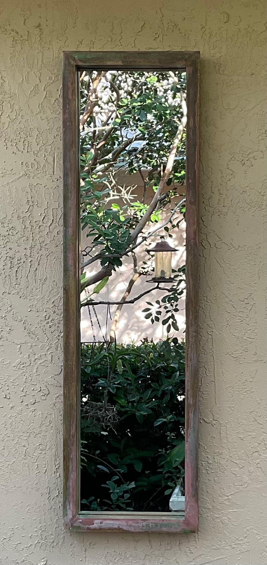 Large narrow Rectangular mirror made of solid brass with beautiful oxidized patina.
Actual glass mirror size is :52”.5 x 12”75 .
The back of the mirror is going to covered before shipping with protective cardboard.