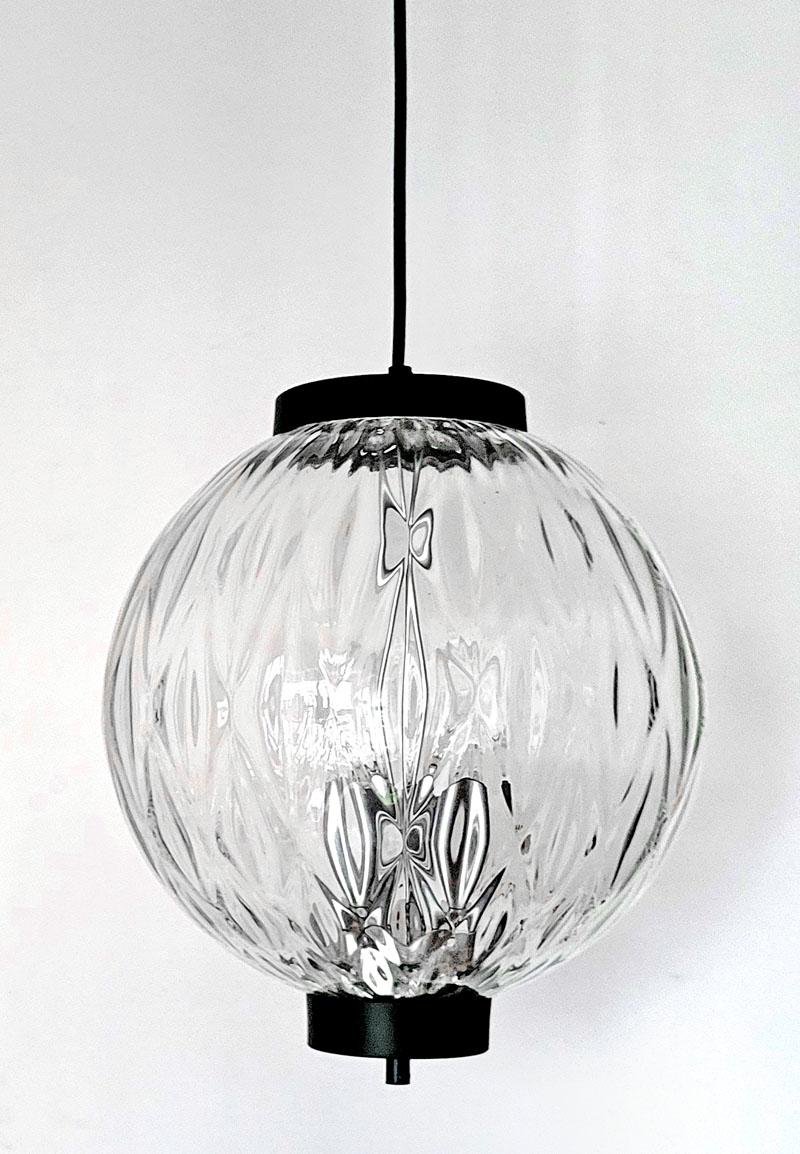 ONE of... hand blown textured glass globe and metal pendant light.
Austria, 1960s.
Lamp sockets: 3.

