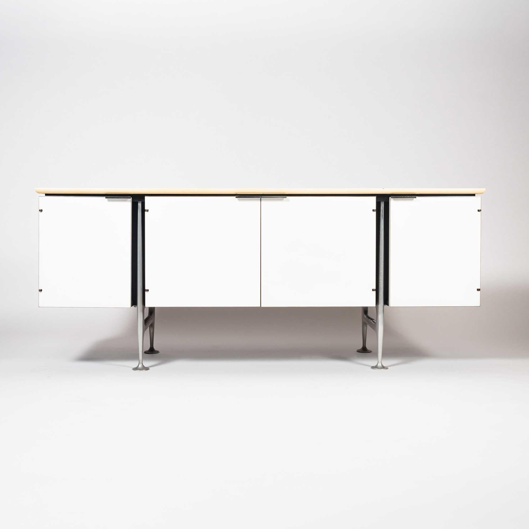 From Wright Auction: The cabinet was a prototype model for The Girard Group created for the Herman Miller showroom; There were only two known to be ever made. The cast aluminum legs hold up laminated frame, with two drawers and one glass shelf. The