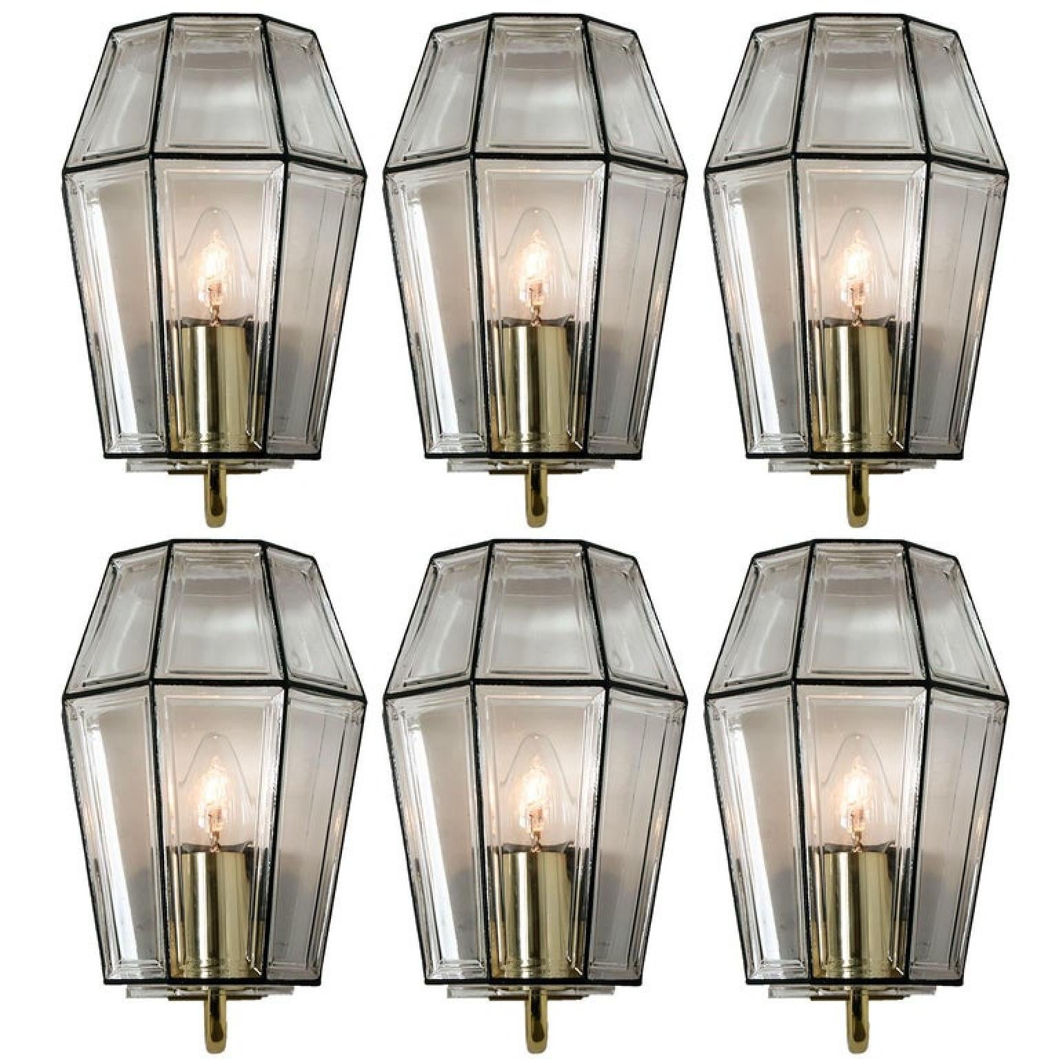 This beautiful and unique set of hand blown glass wall lights were manufactured by Glashütte Limburg in Germany during the 1960s (late 1960s-early 1970s). Beautiful craftsmanship. These midcentury vintage lights feature handmade, elaborate clear