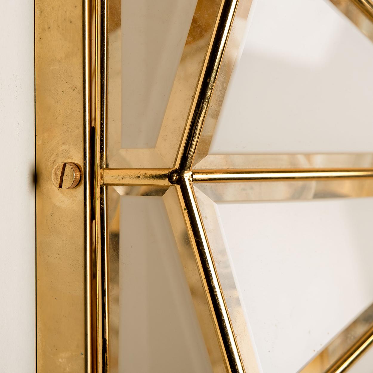 This beautiful and unique octagonal glass light flush mount or wall light is manufactured in Germany during the 1970s, (early 1970s). Nice craftsmanship. Minimal, geometric and simply shaped design. Opal glass with brass frame.

Designed as