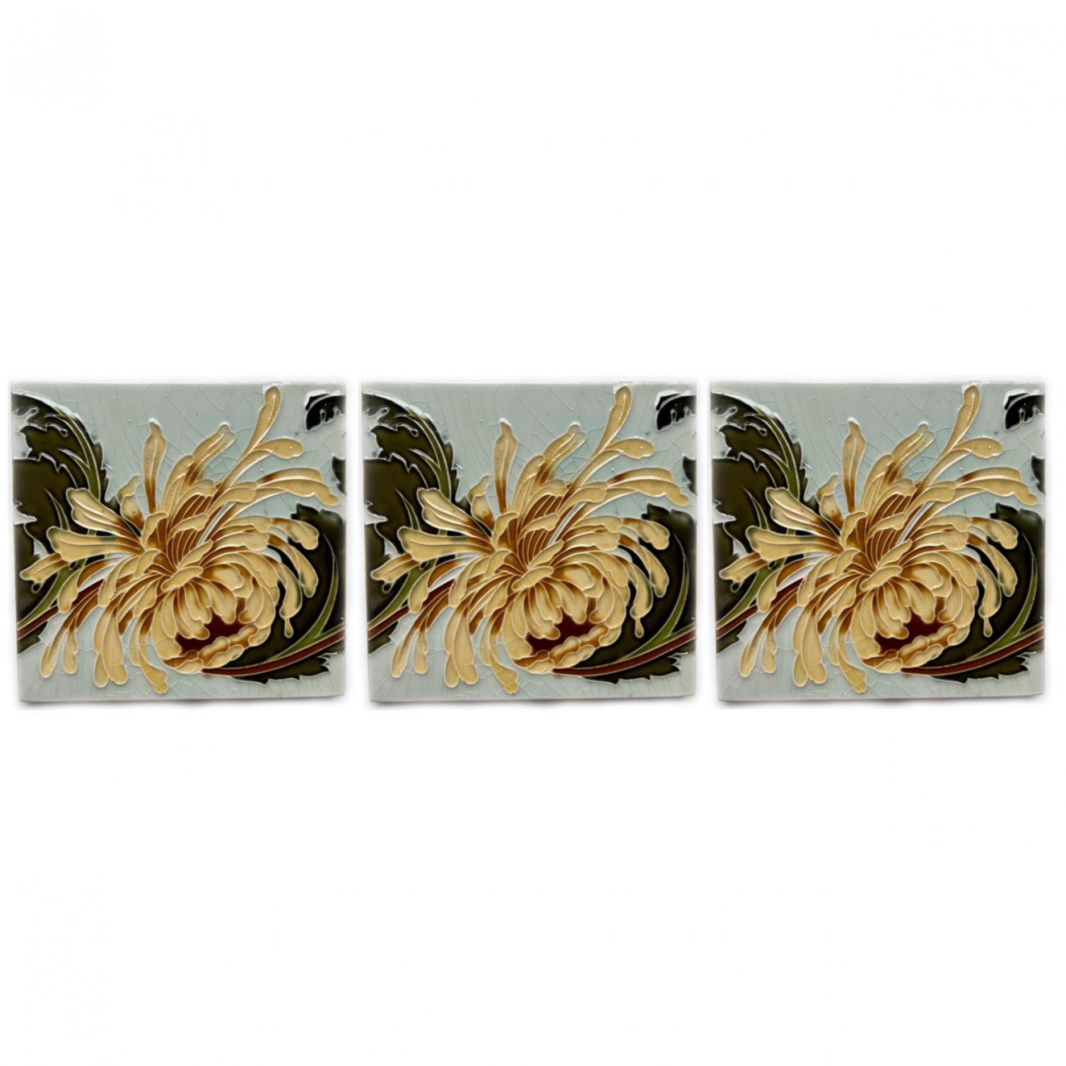 1 of the 60 Art Nouveau ceramic tiles by Gilliot Fabrieken Hemiksem, Belgium, circa 1930. Beautiful original antique tiles with a chrysanthemum in relief. The tile shows a soft yellow flower on a light background. We have matching decorative borders