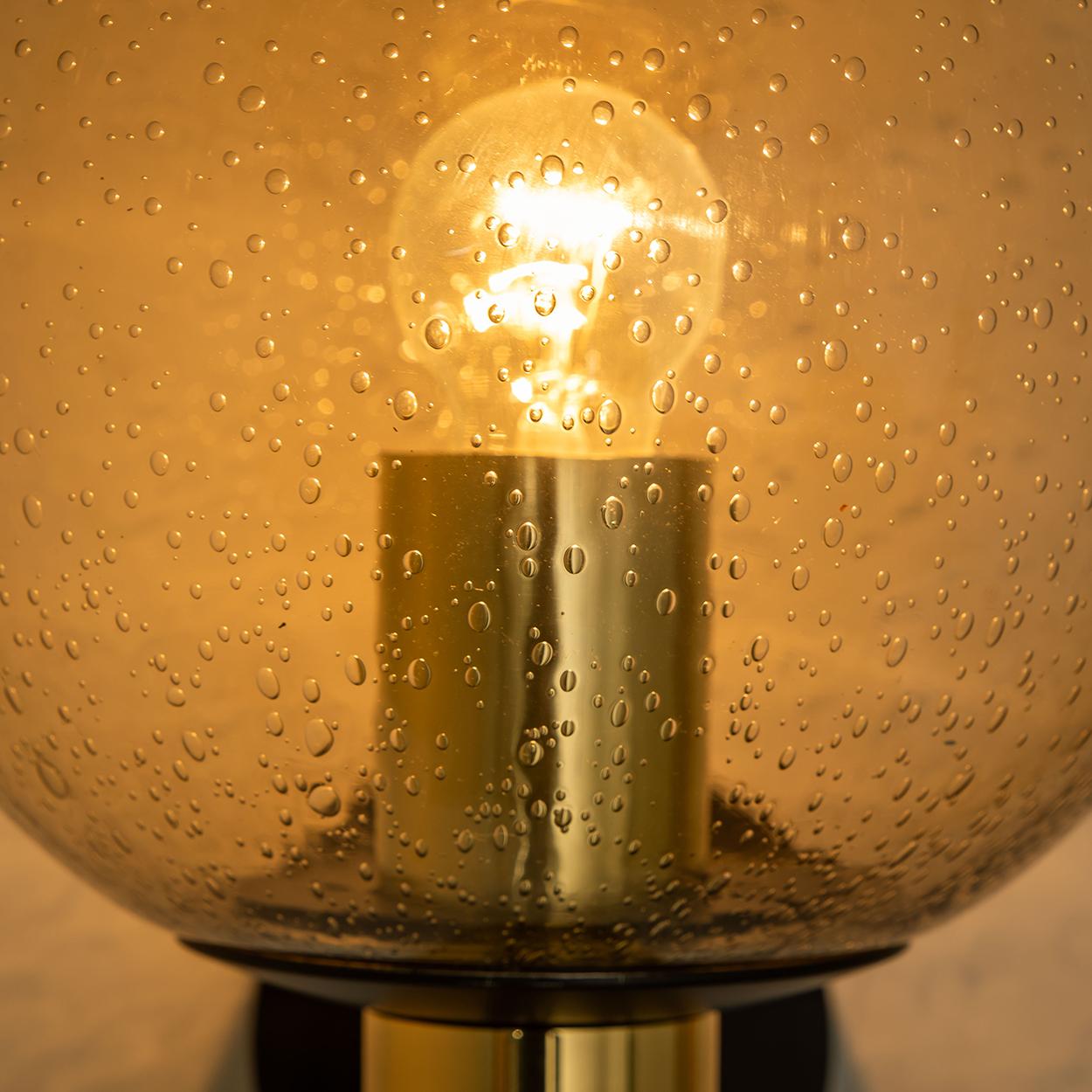 These beautiful globe lamps are made of brass and hand-blown Murano glass. The lamps are from the 1970s and are in good vintage condition. 



 