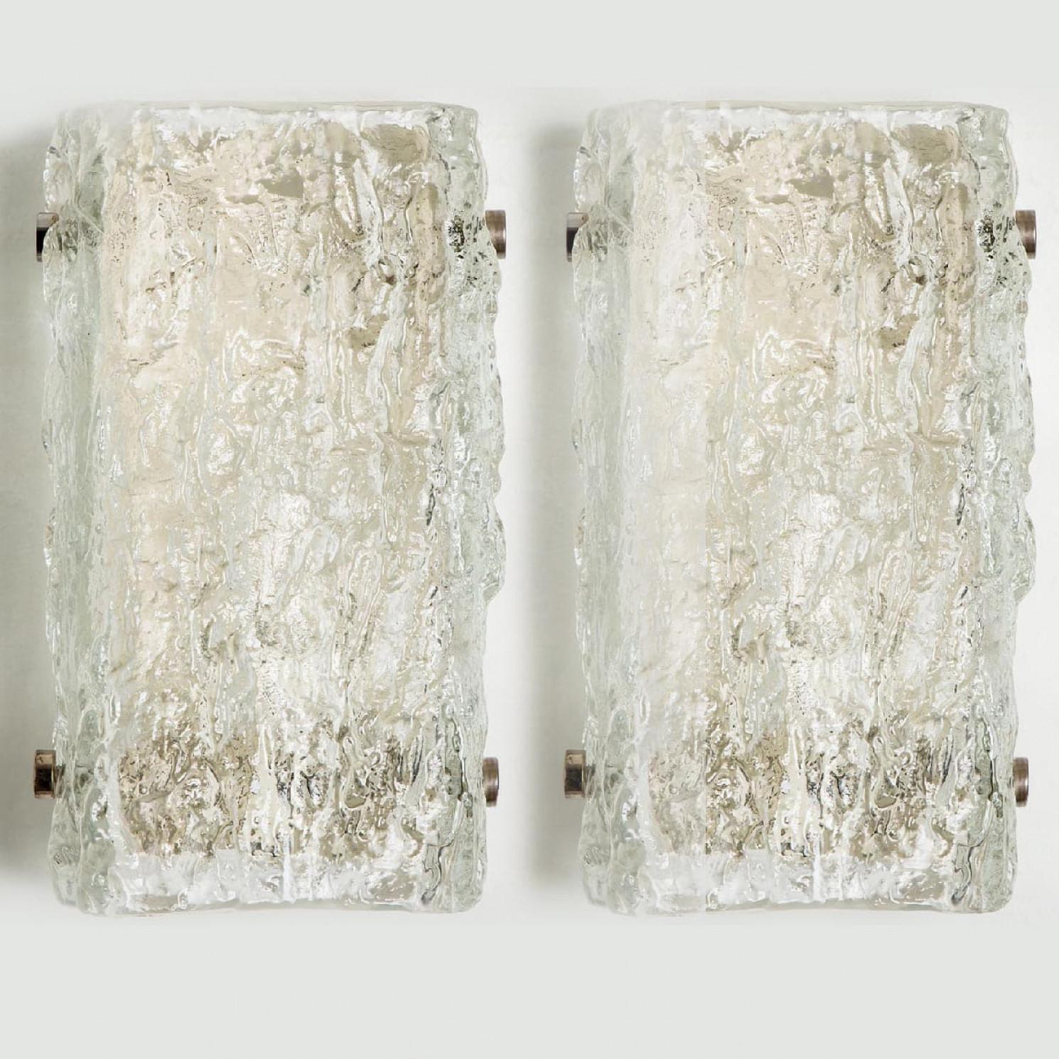 One of the six beautiful high quality light fixture made by J.T. Kalmar Leuchten, Germany.

Manufactured in Mid century, circa 1960.

This wall light features lights made of handmade ice glass and  off white back plate. The sides refract light