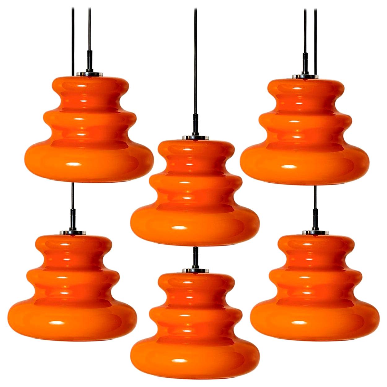 One of the Six Orange Peill 
Putzler Pendant Lights, 1970s