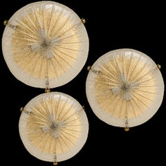 One of the Three Gold Clear Brass and Textured Glass Flush Mount by Hillebrand -