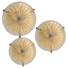 One of the Three Gold Clear Brass and Textured Glass Flush Mount by Hillebrand -