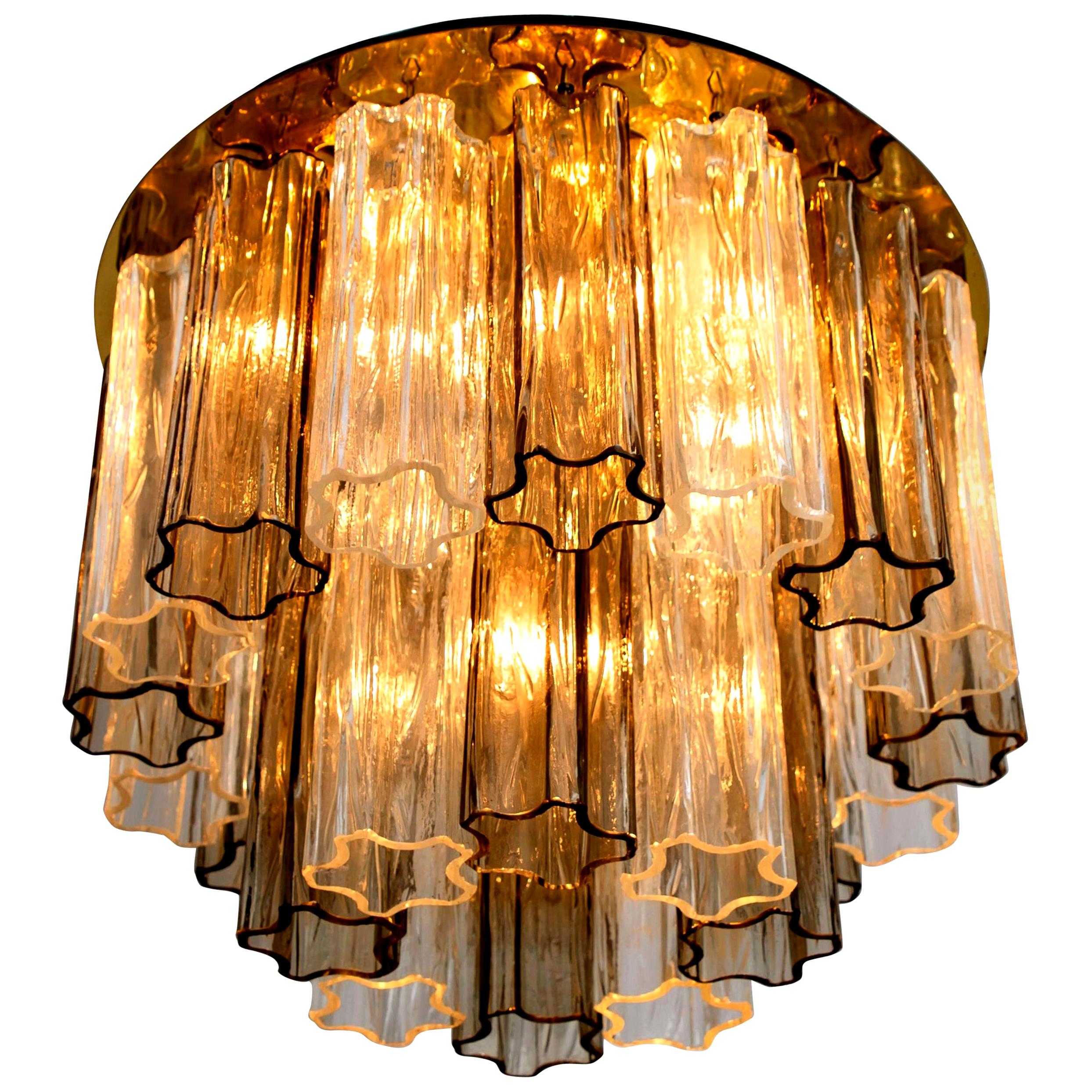 One of the two wonderful two-tier Murano glass tronchi flush mount ceiling lights designed by J.T. Kalmar for Kalmar Franken, Vienna, Austria. Manufactured in circa 1960. These chandelier is handmade and a high quality piece. Murano tubes in smoked