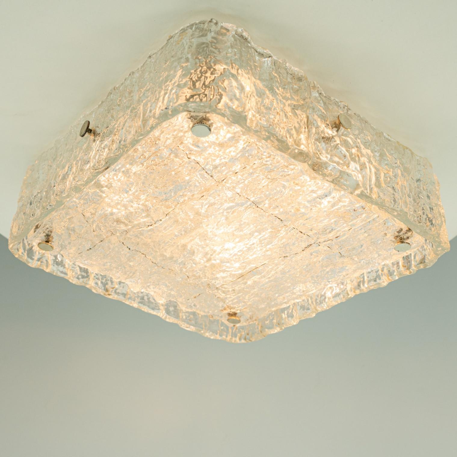 Beautiful high quality light fixture made by Kaiser Leuchten, Germany. Manufactured in Mid century, 1970s

This  made of  handmade rock glass. The sides refract light beautifully and are perfect for a soft, warm and welcoming glow in the