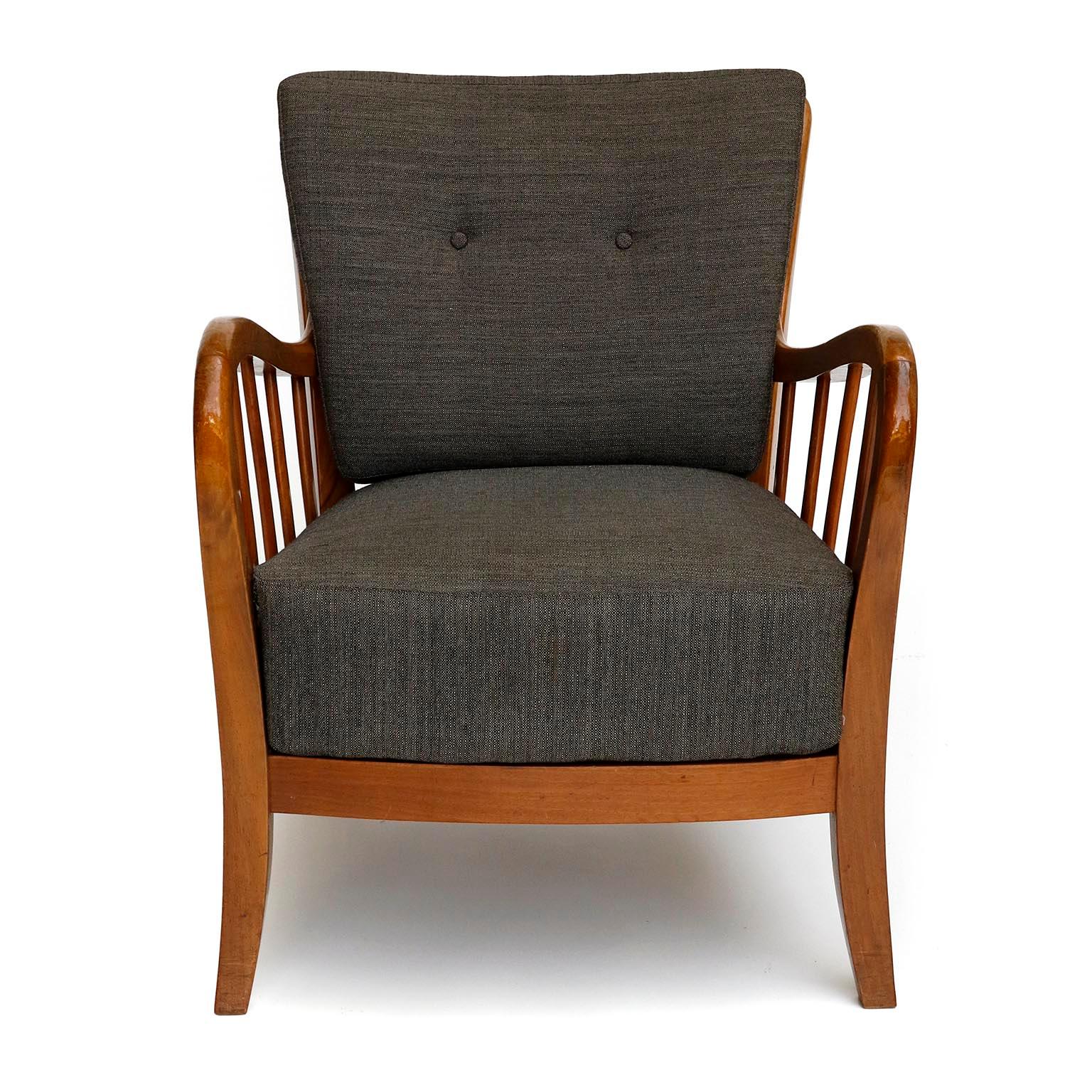 An arm lounge chair manufactured by Thonet, Vienna, Austria, circa 1940 ( late 1930s or early 1940s).
The design is attributed to Josef Frank. The chairs are labeled with Thonet on the underside.
This large, comfortable, handmade chair is made of
