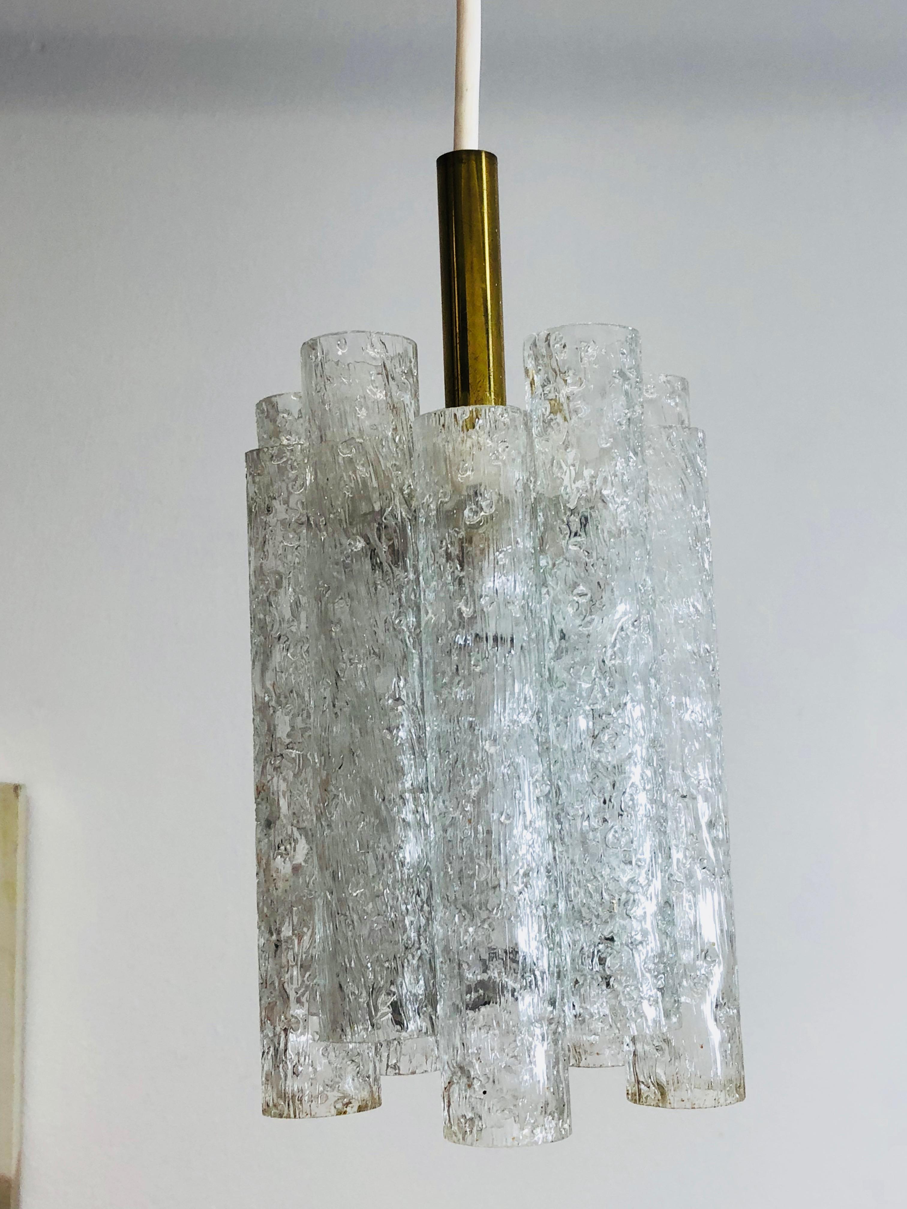 Gorgeous glass tube pendant light made by Doria Leuchten, Germany. It is in very good condition and requires a European E14 candelabra bulb, up to 60 watts. It is totally approximate 30