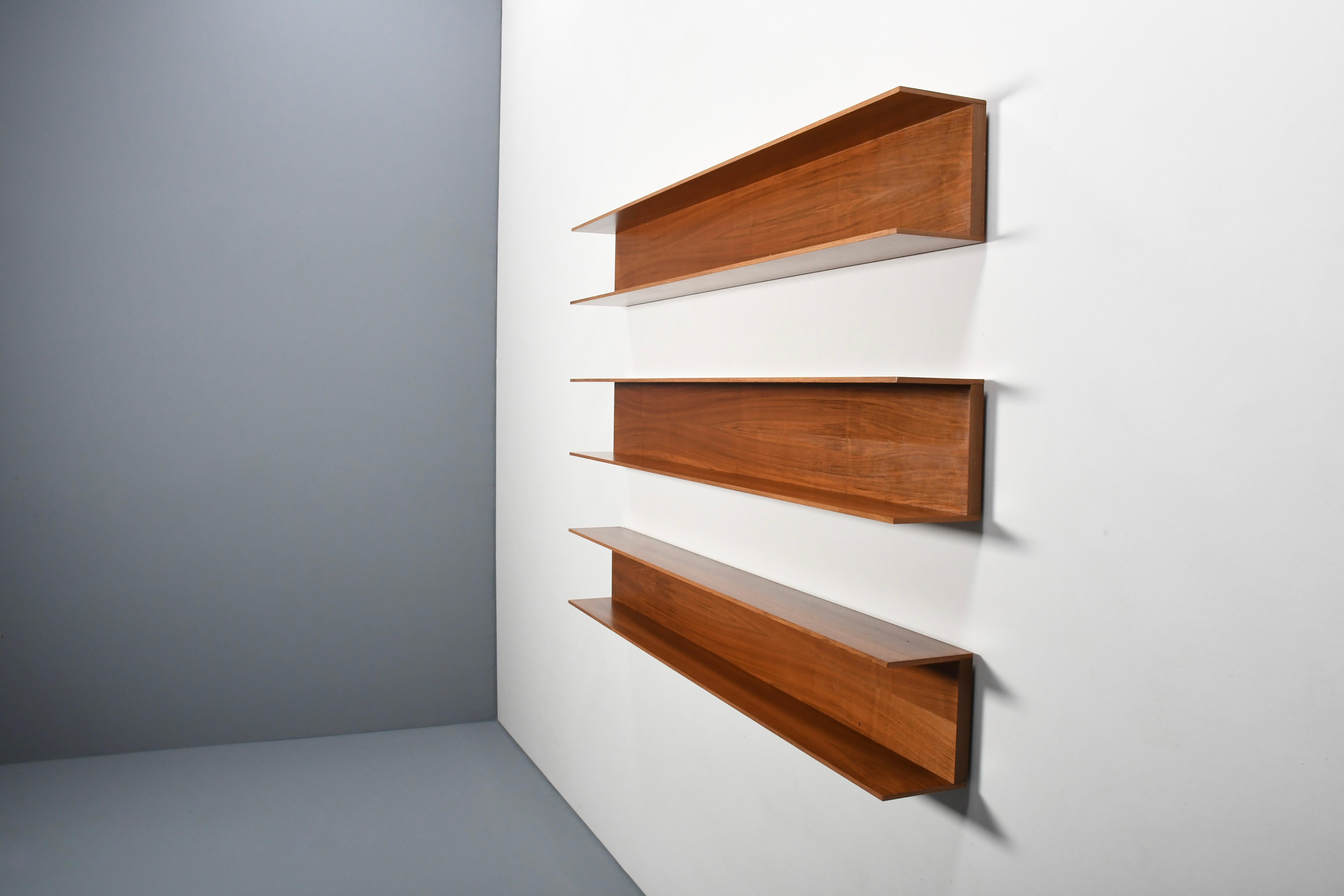 Wall shelves designed by Walter Wirz in very good condition.

Manufactured by Wilhelm Renz in the 1960s.

The shelves are made of a beautiful teak wood and have a gorgeous wood grain and color. 

The shelves can be combined in many different ways,