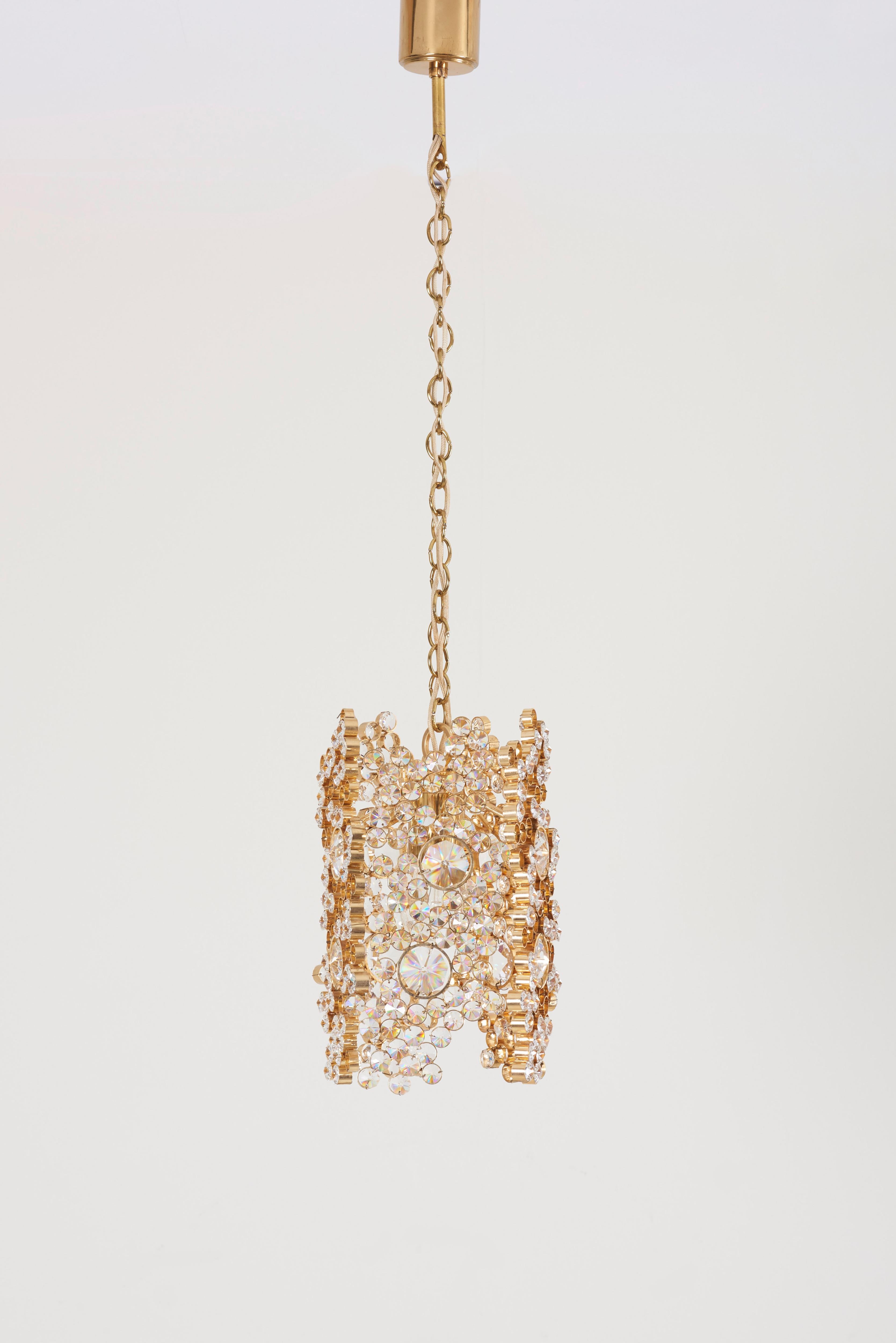 Palwa gilded brass and crystal glass encrusted pendant lamp, model S107.
The lamp is handmade and in excellent condition and float every room in a beautiful warm light. It is fitted with one E27 bulb. 

To be on the safe side, the lamp should be
