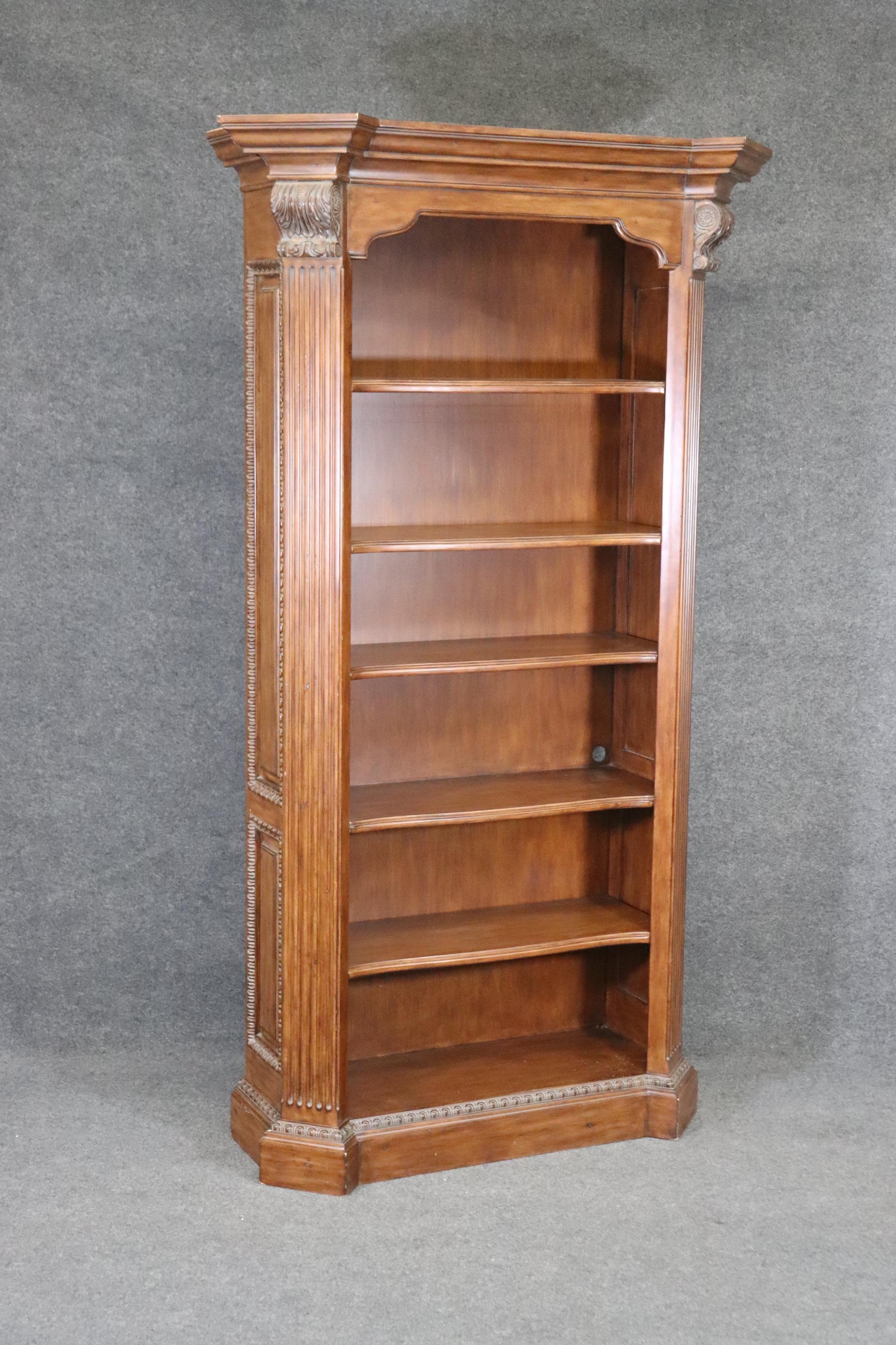 This is one of two available bookcases owned by the former president of the Philadelphia 76ers Basketball team. This bookcase is designed in the Georgian style and is in good vintage condition with some holes cut in the back for a bookshelf stereo