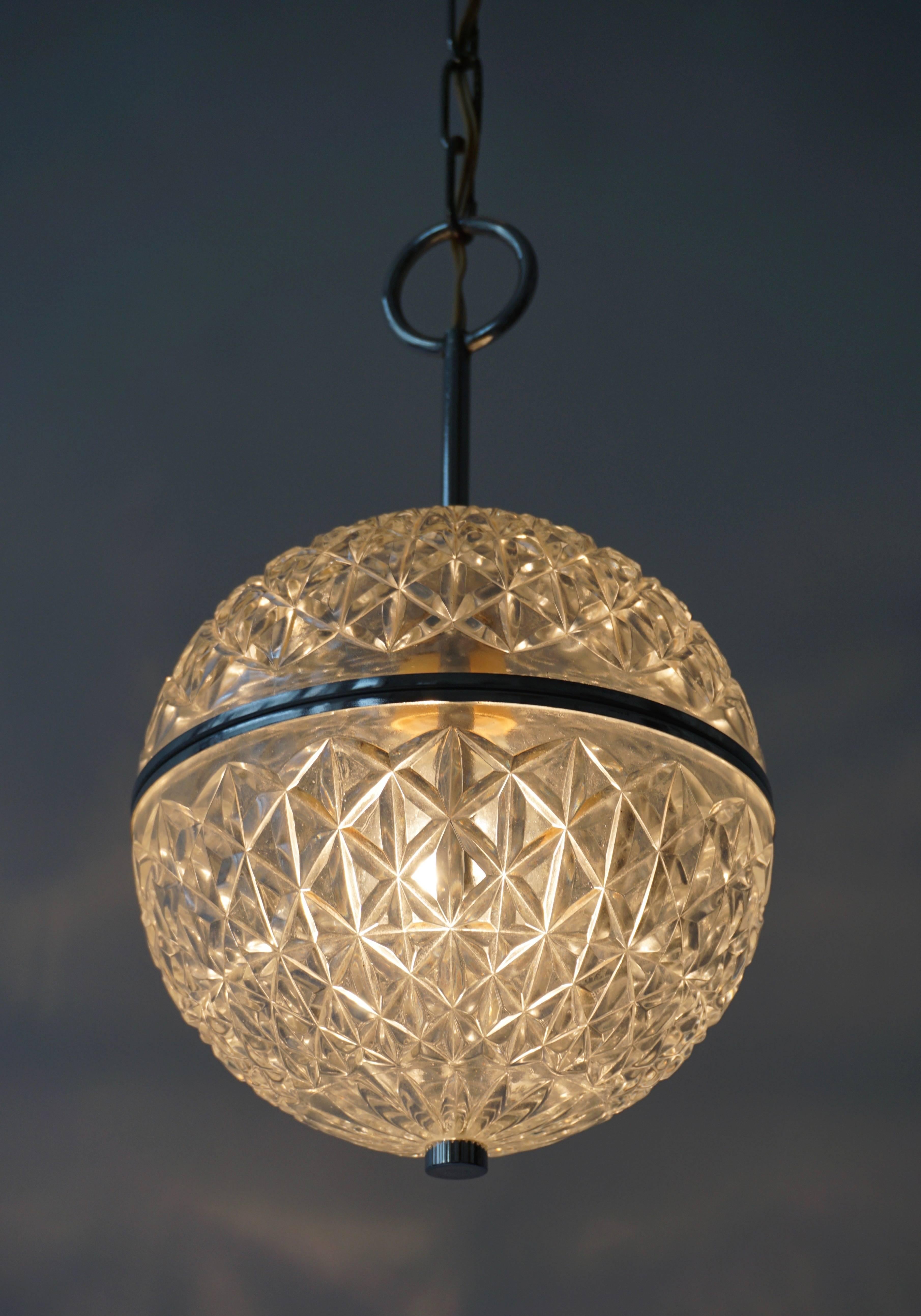 20ième siècle One of Two Crystal Glass and Brass Globe Pendant Lights en vente