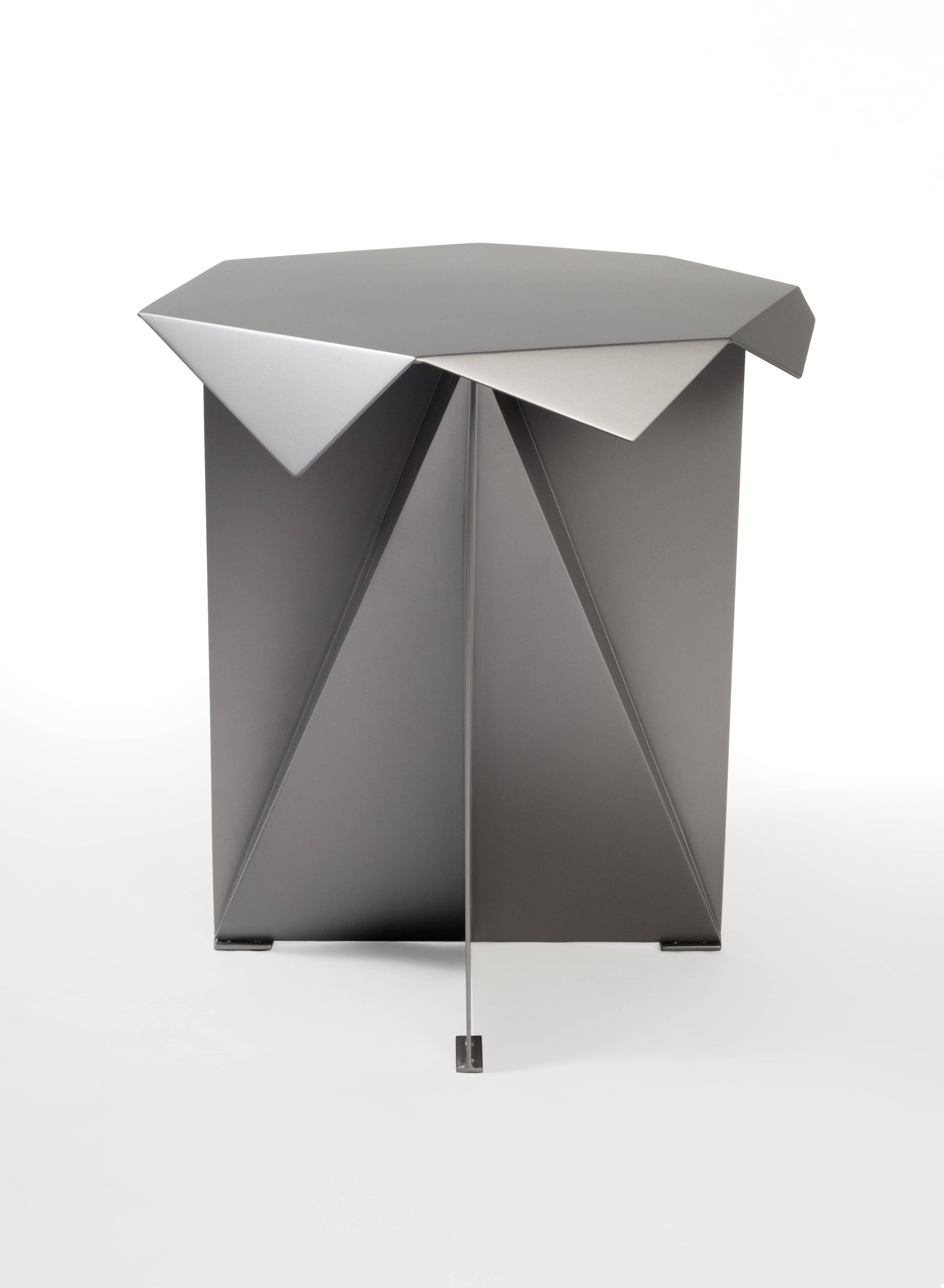 A very sculptural powder-coated steel table in high end quality.

