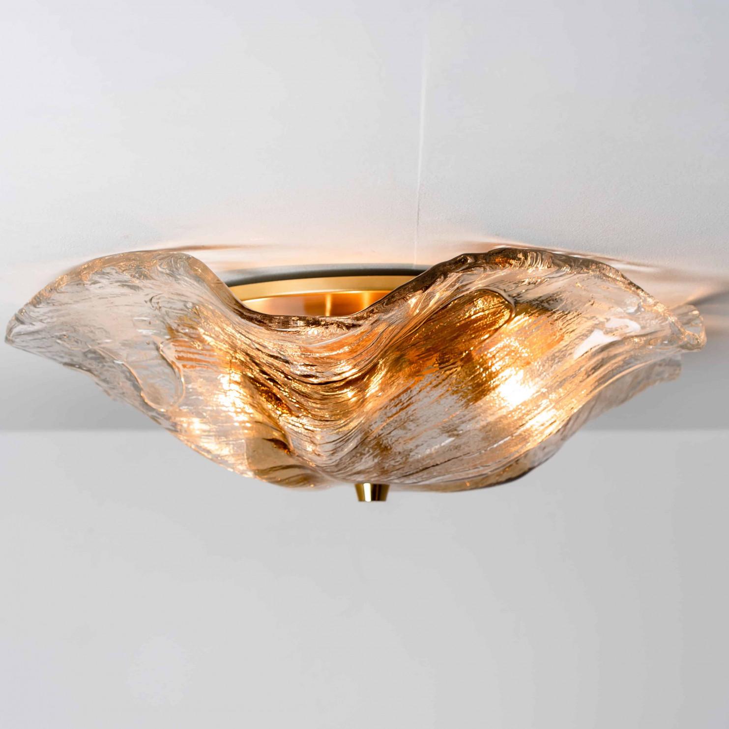 1 of the 2 flush mounts /wall lights, gorgeous and stylish, manufactured by Kalmar Franken, Austria, 1960s. With a handcrafted thick ice glass plate attached to the center. With brass colored backplate. A truly extraordinarily design!

This lights