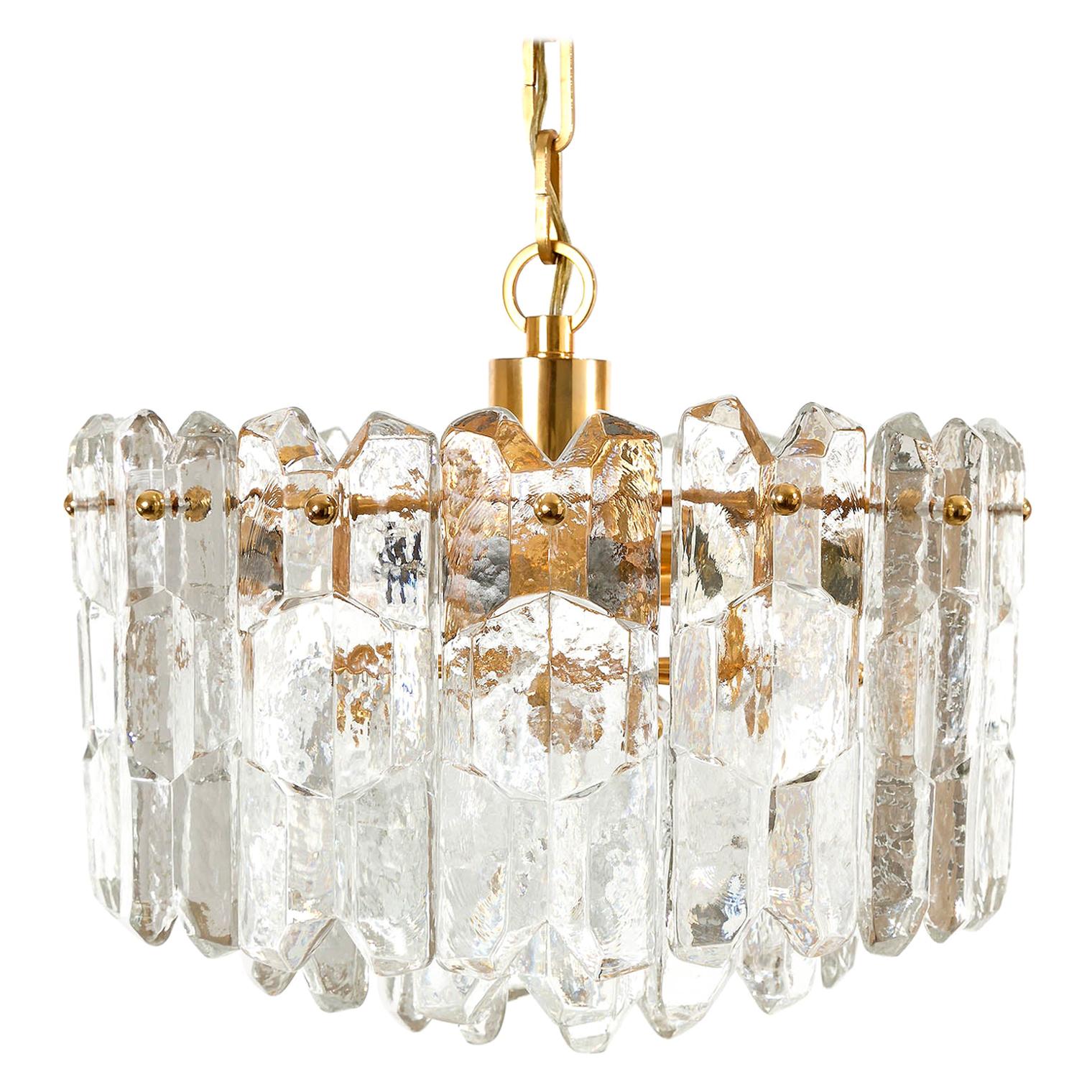 One of two very exquisite 24-carat gold-plated brass and clear brilliant glass Hollywood Regency light fixtures model 'Palazzo' by J.T. Kalmar, Vienna, Austria, manufactured in midcentury, circa 1970 (late 1960s or early 1970s).
The lamp is marked