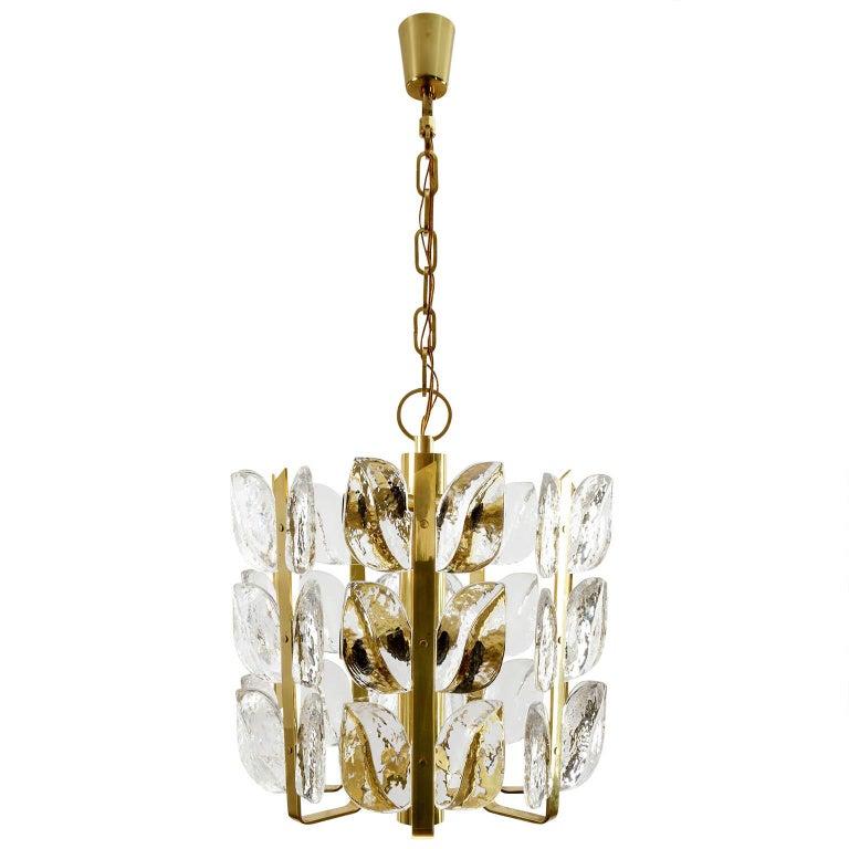 One of two beautiful and handmade high quality light fixtures model 'Florida' by J.T. Kalmar, Austria, manufactured in midcentury, circa 1970 (late 1960s or early 1970s). The price is per fixture. They are sold individually or as pair.
The lamps