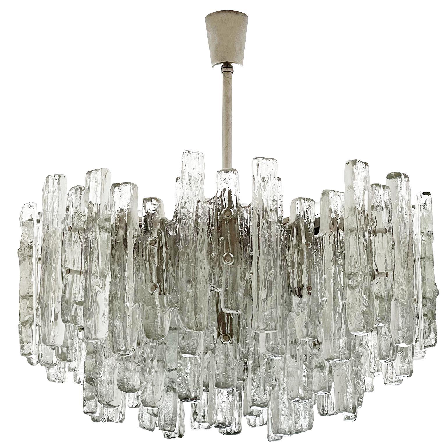 One of two extra large light fixtures model 'PUCK' no. 3864 by Kalmar, Austria, manufactured in midcentury, circa 1970 (late 1960s-early 1970s). These chandeliers are the largest version of this series. The piece has great volume and in reality it