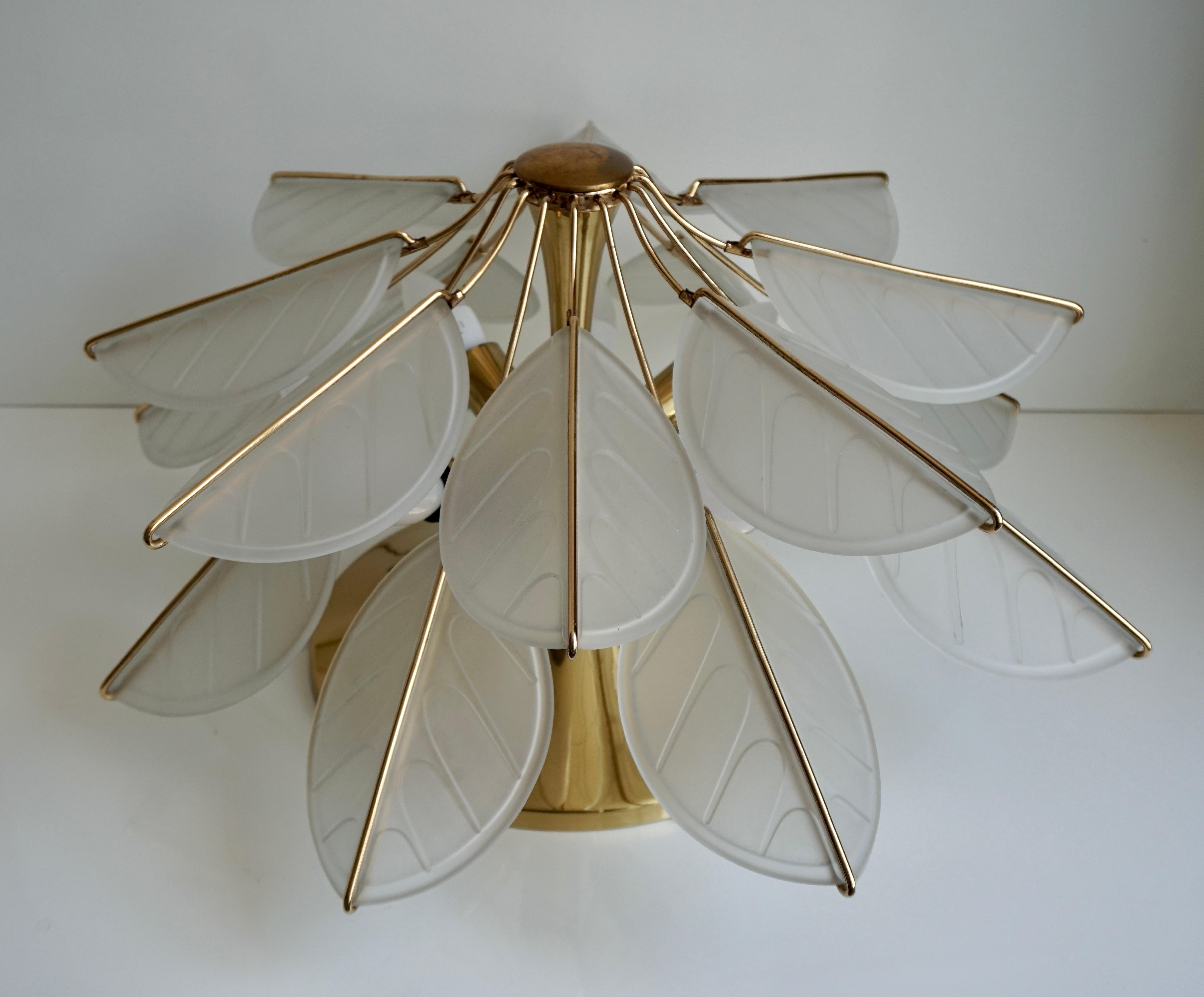 Italian brass flushmount ceiling light In the shape of a star or flower with ribbed Murano glass leaves.  
Condition: Excellent vintage condition, minor wear consistent with age and use.

Dimensions flush mount or wall light;
Height: