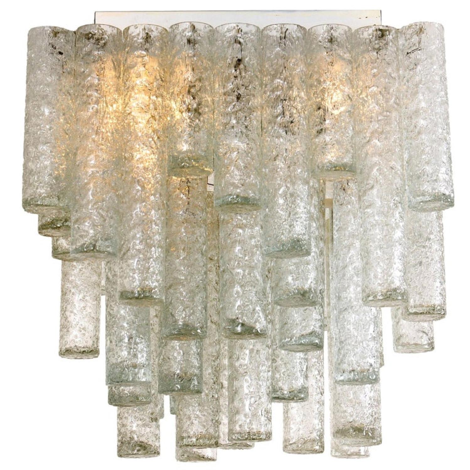 This beautiful square flushmount was manufactured by Doria in Germany in the 1960s. It consists of 47 organic glass tubes of different lengths.
This square flushmount is very unique and rare to find. The chandelier is in excellent vintage