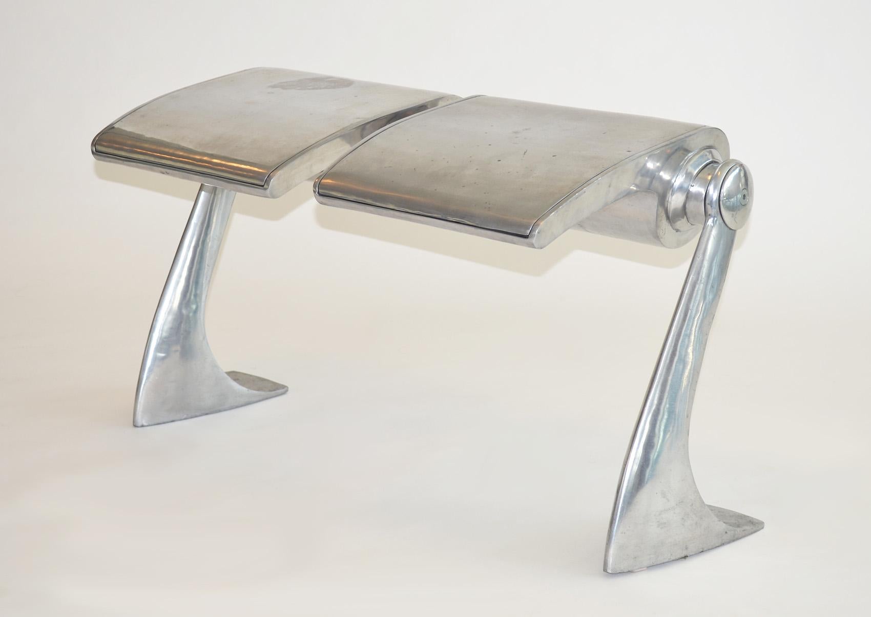 One-off bench stool or seat in polished aluminum industrial hadid style 90s.
Purchased late 1990's at ICFF, New York, NY. Sturdy polished aircraft aluminum two-seat construction reminiscent of public seating, perfect for bedroom, hall or as an