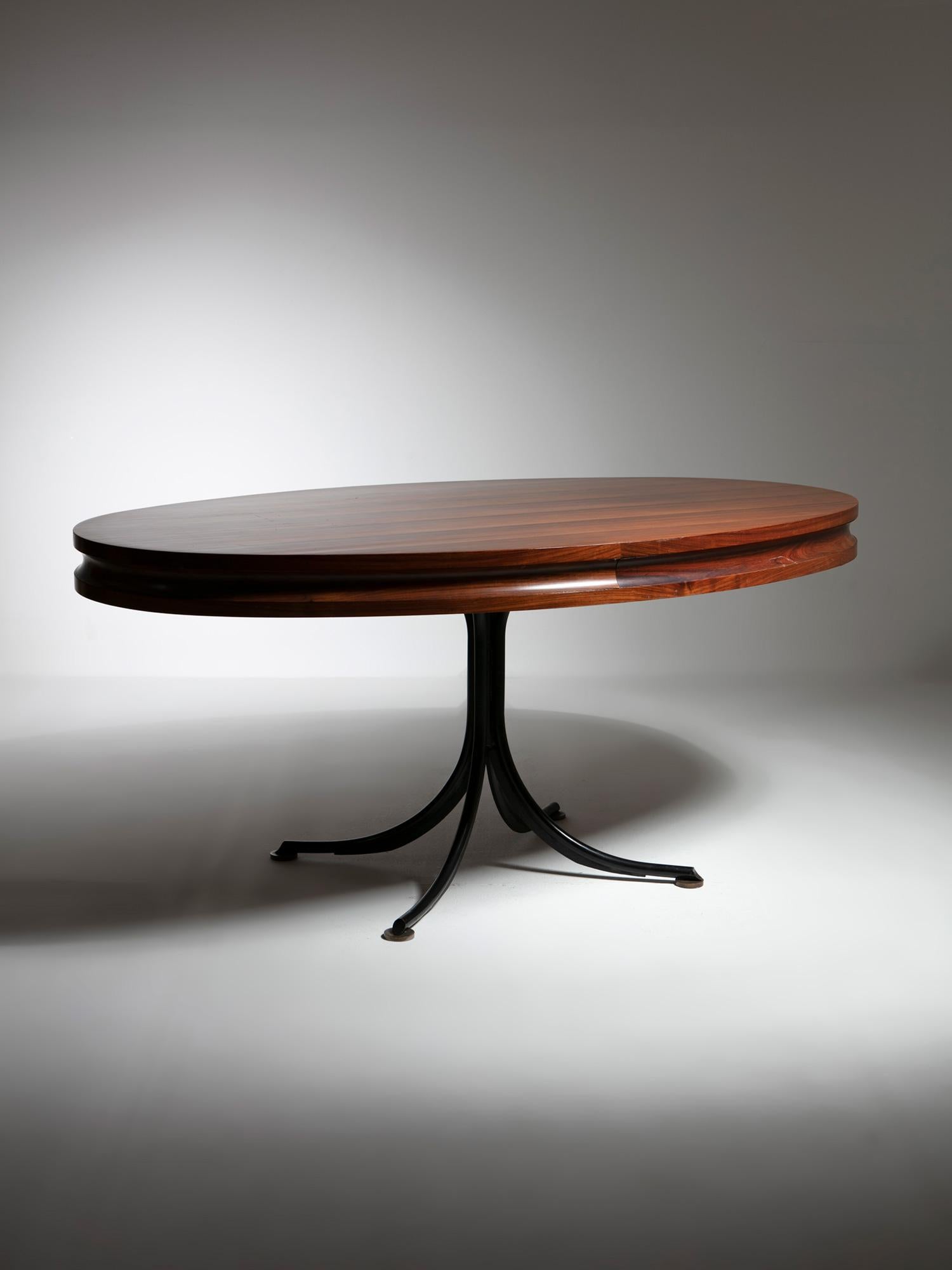 Custom made Italian 60s oval wood dining table by Adelmo Rascaroli.
Black metal base with brass feet and wood top.