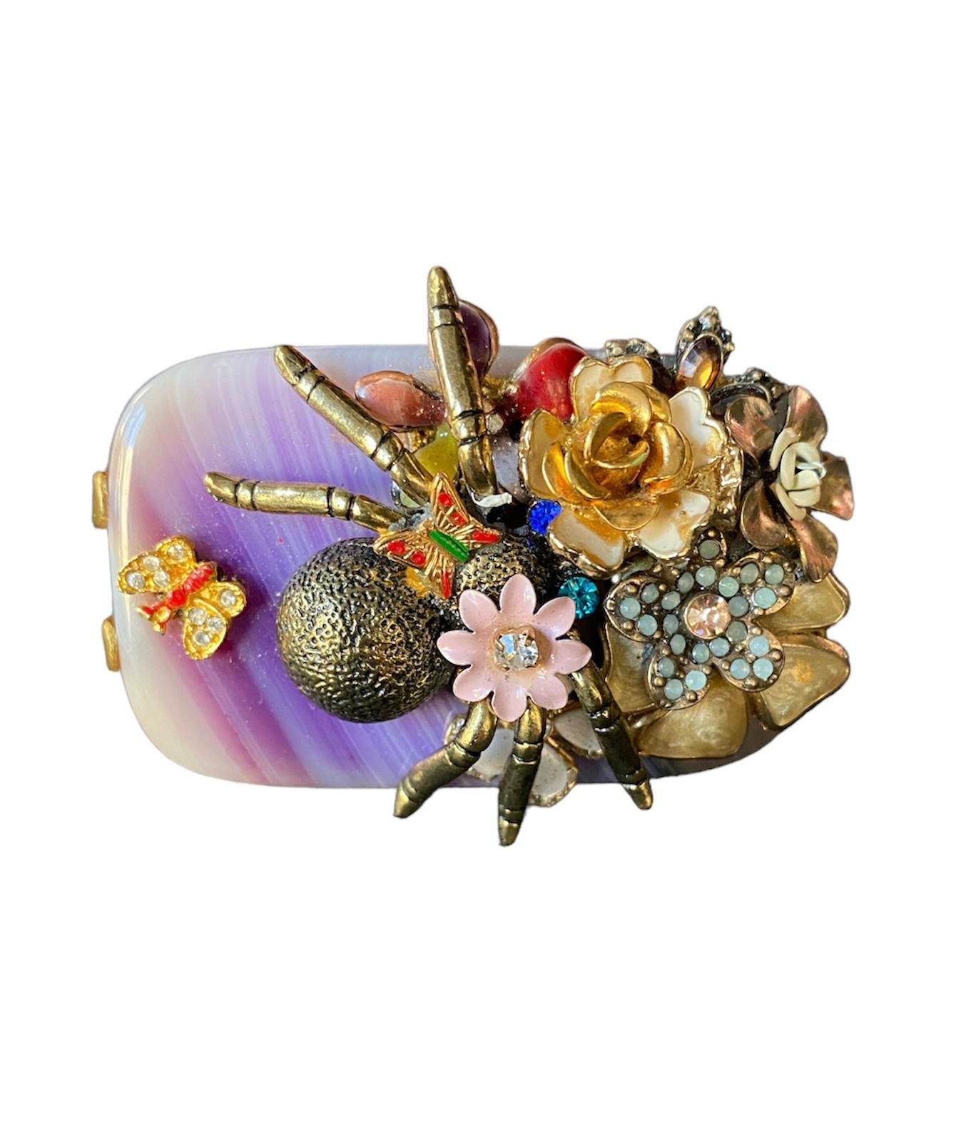 This is a unique piece created for Ludmila Navarro, fine artist & jewellery designer. A totally handmade jewel which it was created from a sustainable process during which she recovers and improves several antique and vintage jewels and elements