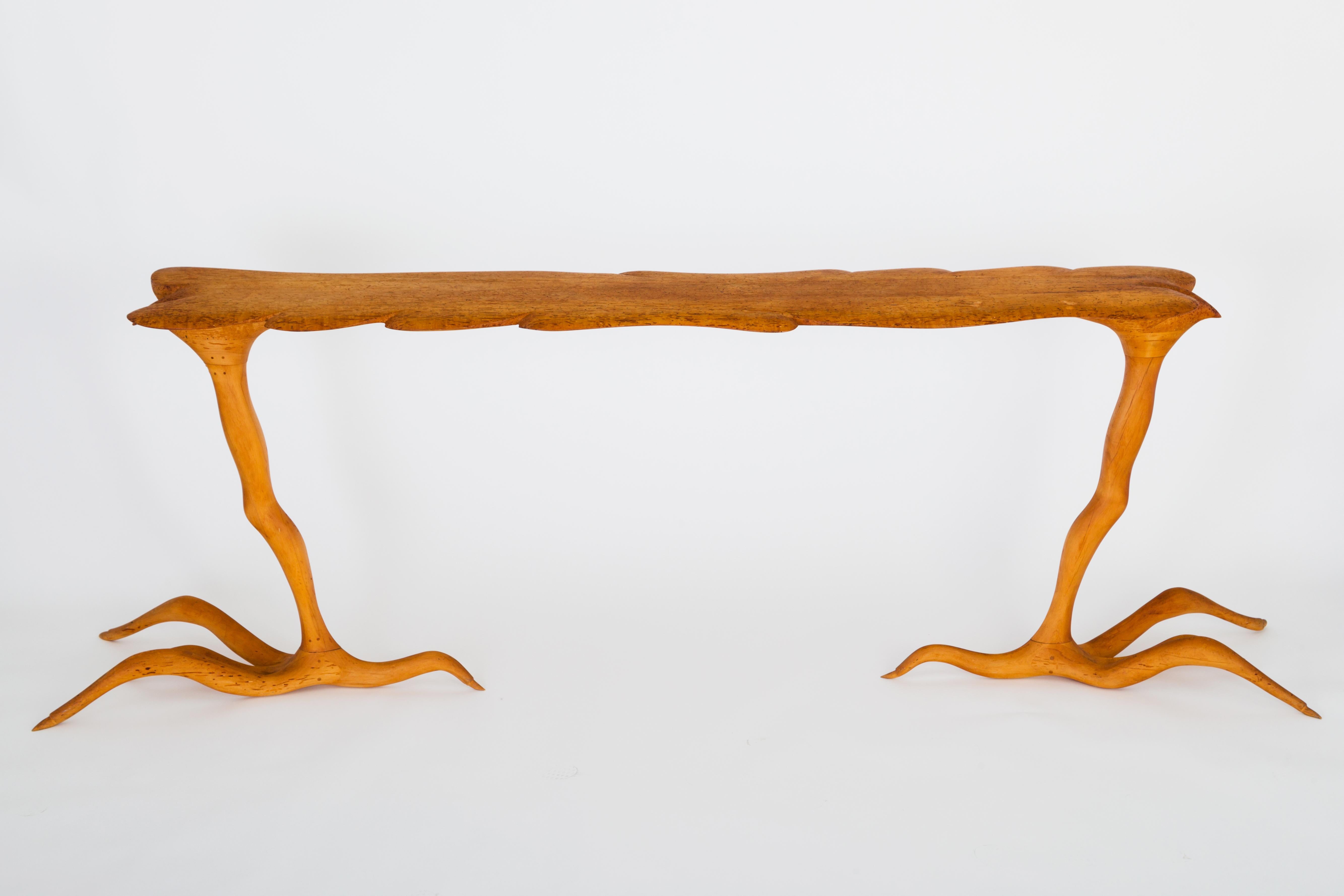A one-off, fantastical table by American craftsman, Andrew J Willner, executed in rare, spalted wormy maple, its five individual sections sculpted by hand and constructed with pegged mortise and tenon joinery.  A dramatic pair of legs that are an