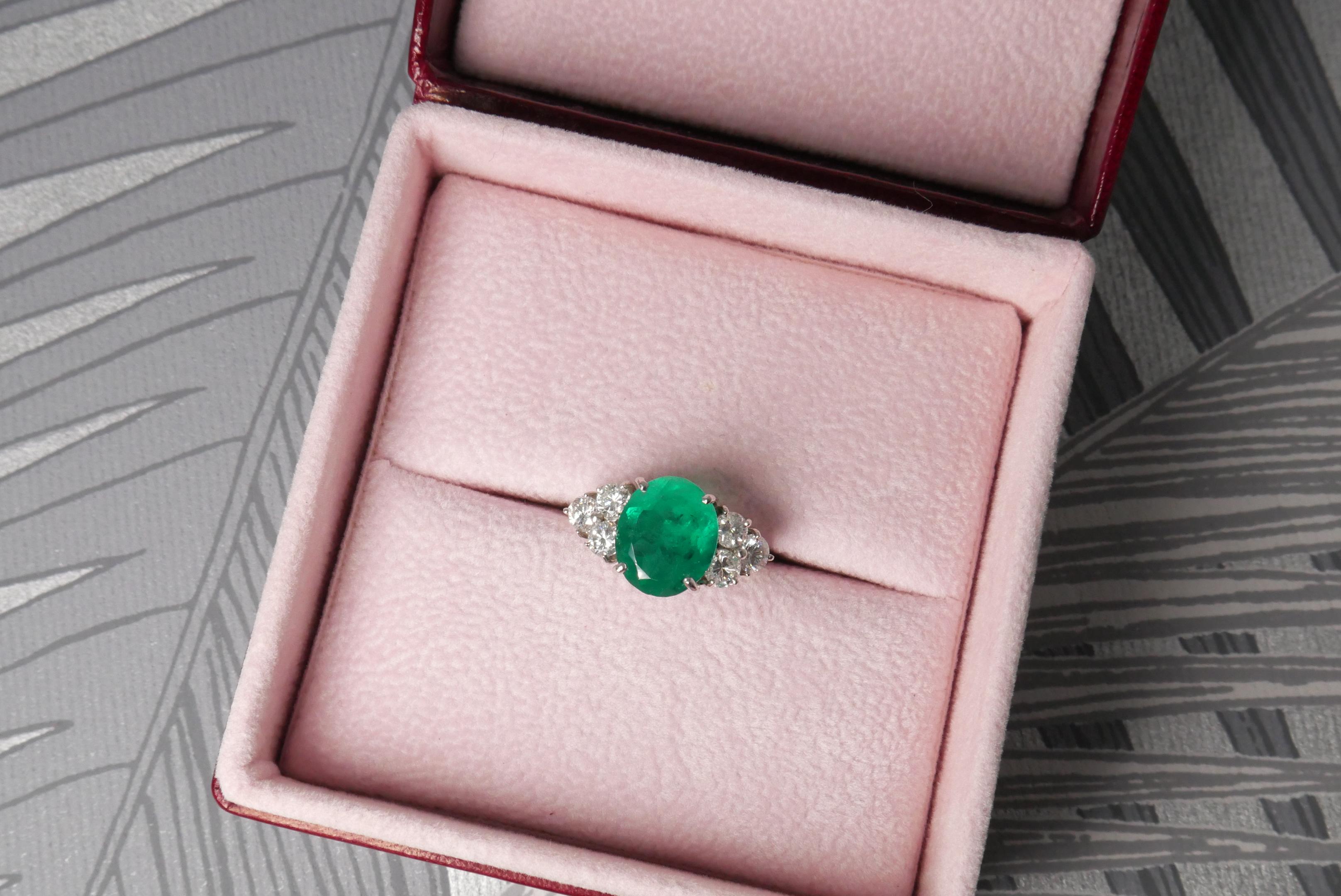 Oval Cut 2.87 Carats Emerald Ring with Diamonds in White Gold For Sale