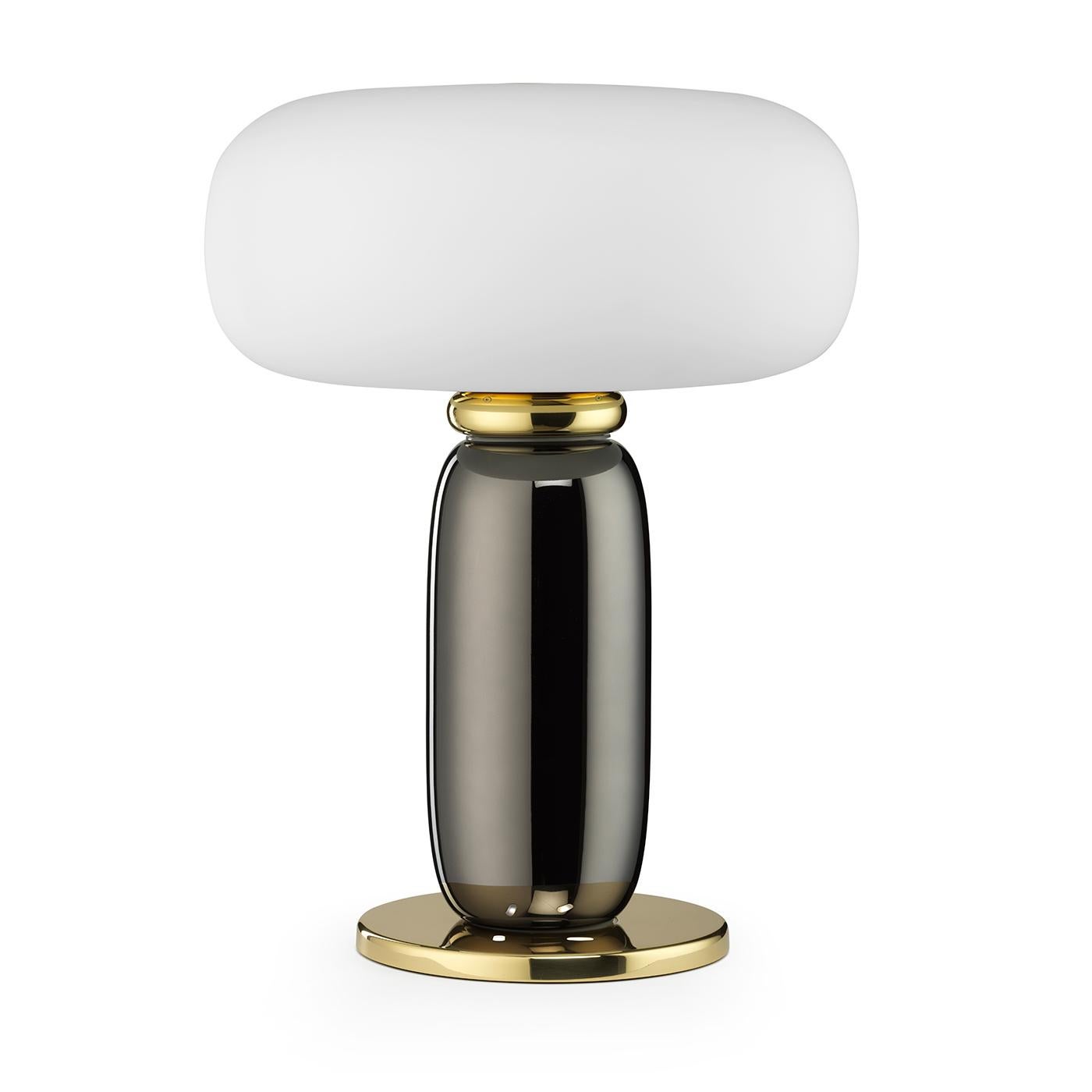 A fascinating combination of hues and materials, this table lamp will make an elegant addition to a console or writing desk in both a modern or traditional home. Delivering a strong, powerful presence, it is fashioned of polished gold-finished brass