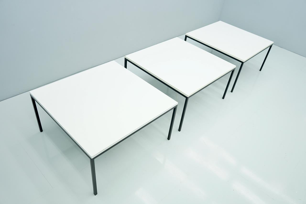 One of three side or coffee tables in black lacquered metal base and table top in Formica.
Good to very good condition.