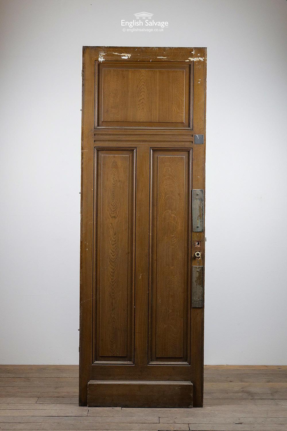 Salvaged three panel door from a property in France, one of several we have in stock. This one is painted cream one side with an oak veneer stain to the other side. Three hinges, push plates, old lock and fitting remain. Some scuffs and marks as