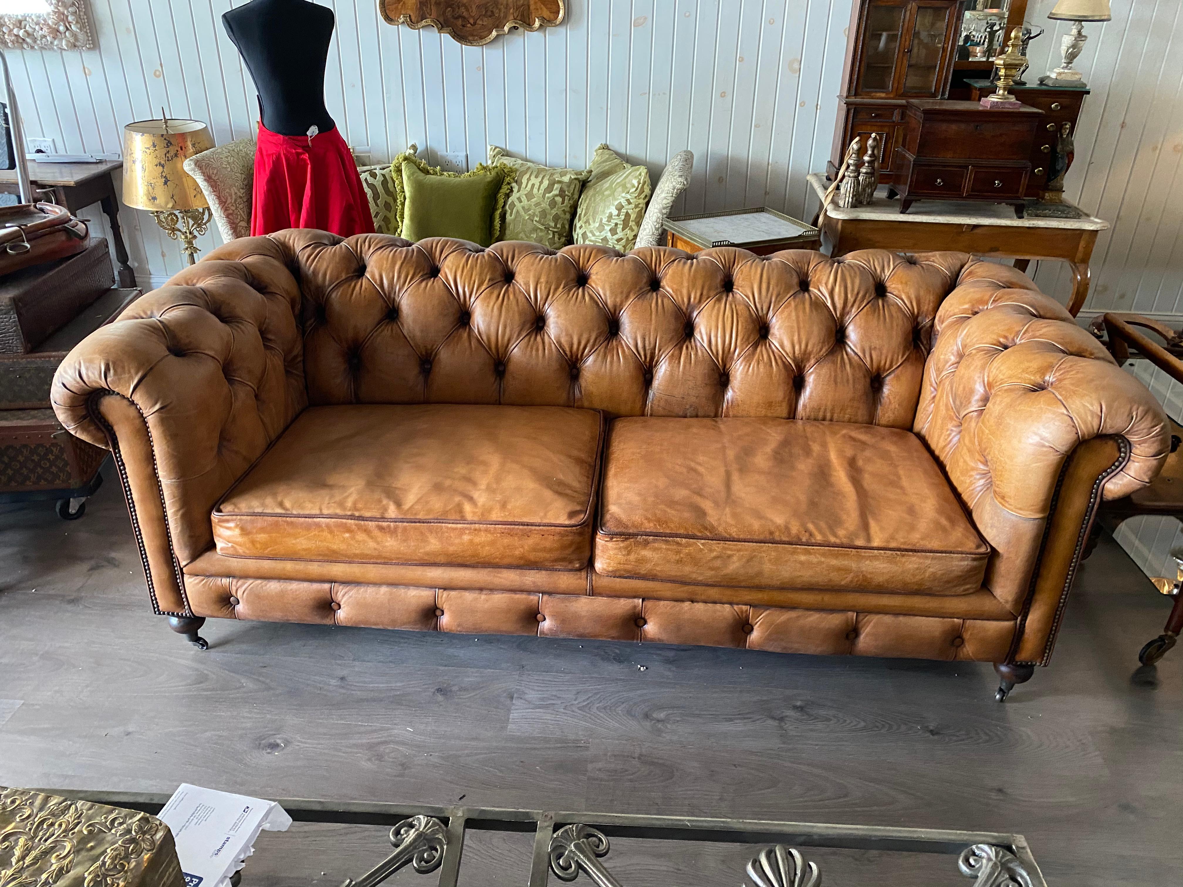 One pair English style leather Chesterfield, great color with a hand applied patina. Old world look with new construction From the Thomas Jolly Antiques collection. Priced per sofa.