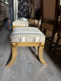 One pair of Italian Stools With Painted And Gilt Finish, Saber Legs, Price item.
