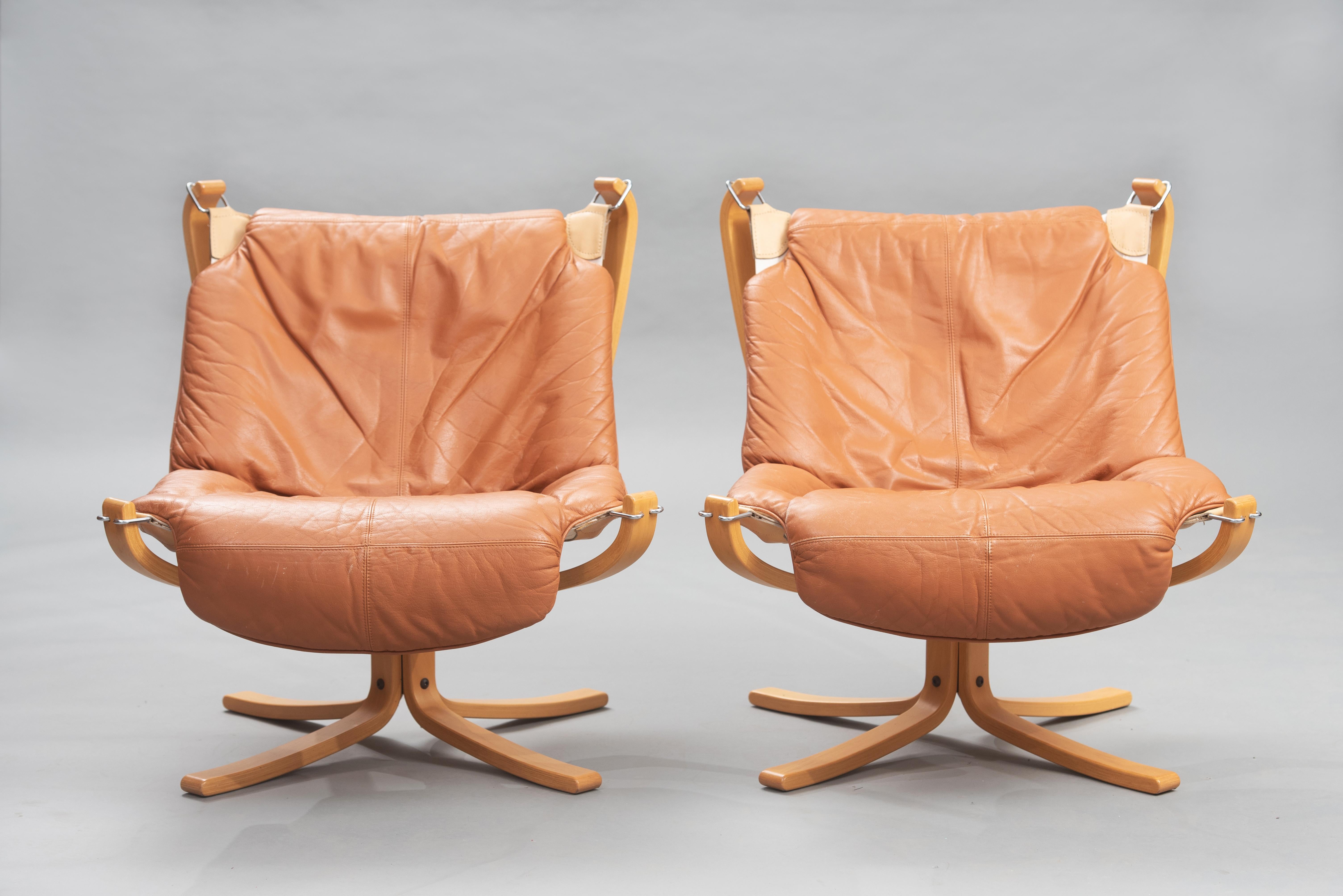 One pair of cognac leather and beech “Falcon” chairs. by Sigurd Ressel produced by Vatne Mobler in the 1970s.